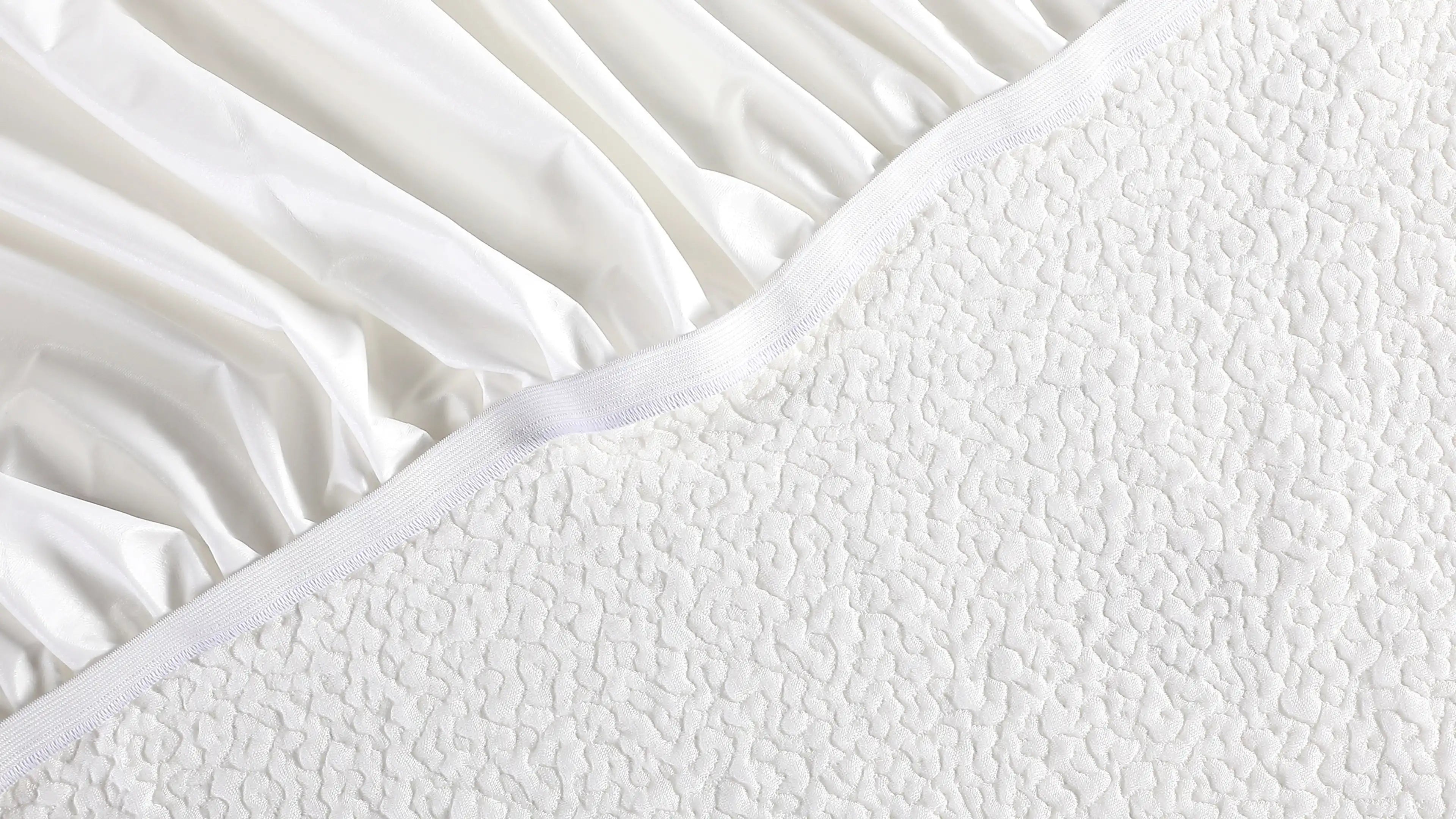 a close up of a white bed sheet