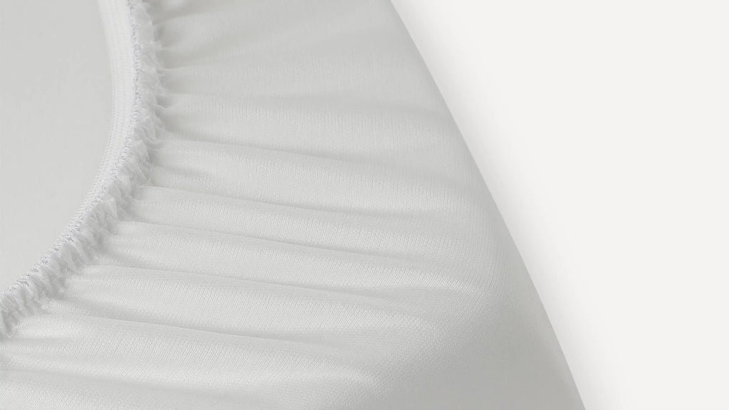 a white pillow with fray edges and fray edges