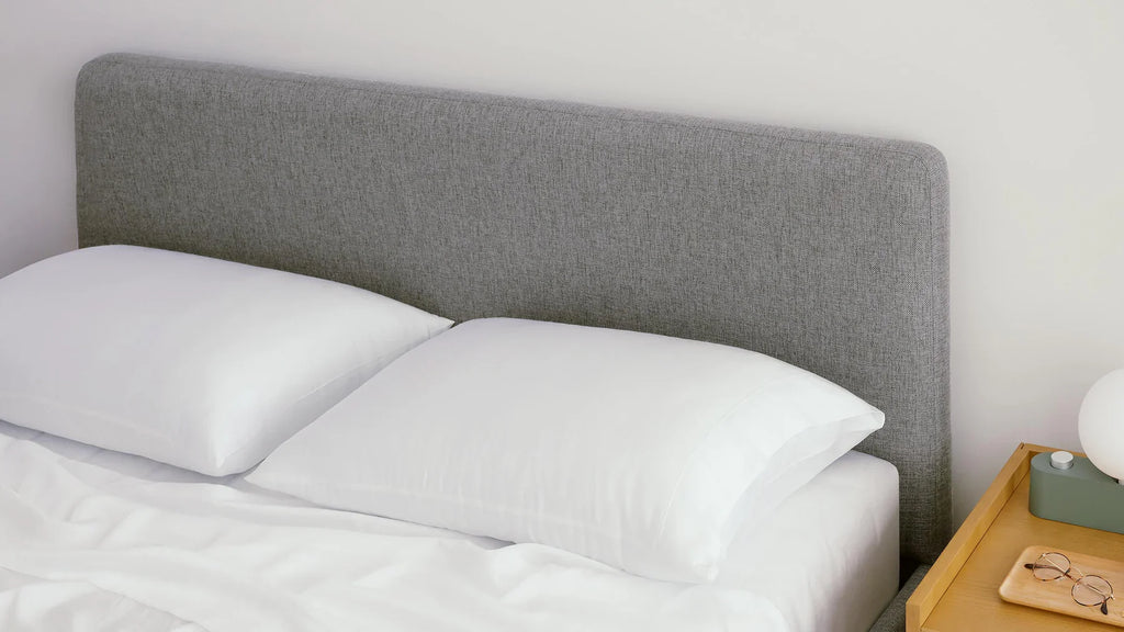 light gray headboard on bed