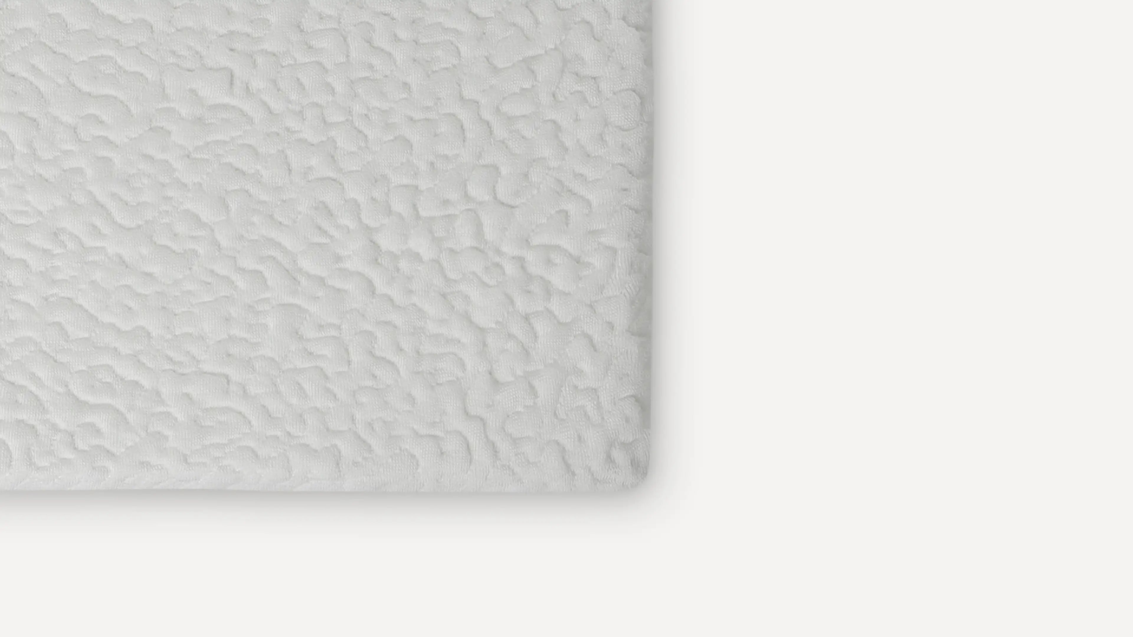 a white wall with a textured surface