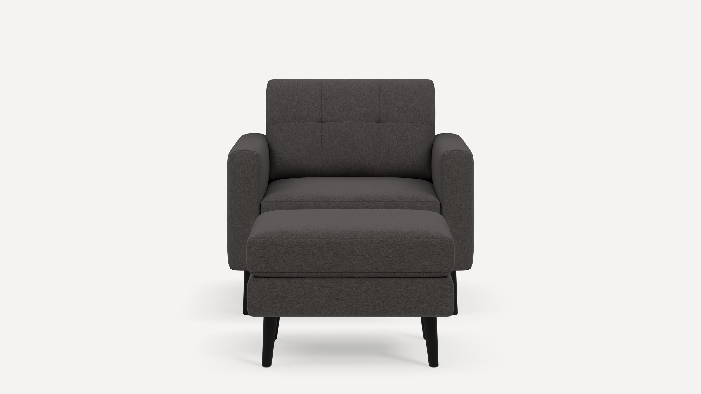 Front view of a modern dark gray fabric armchair with a cushioned seat and backrest, supported by four black legs.