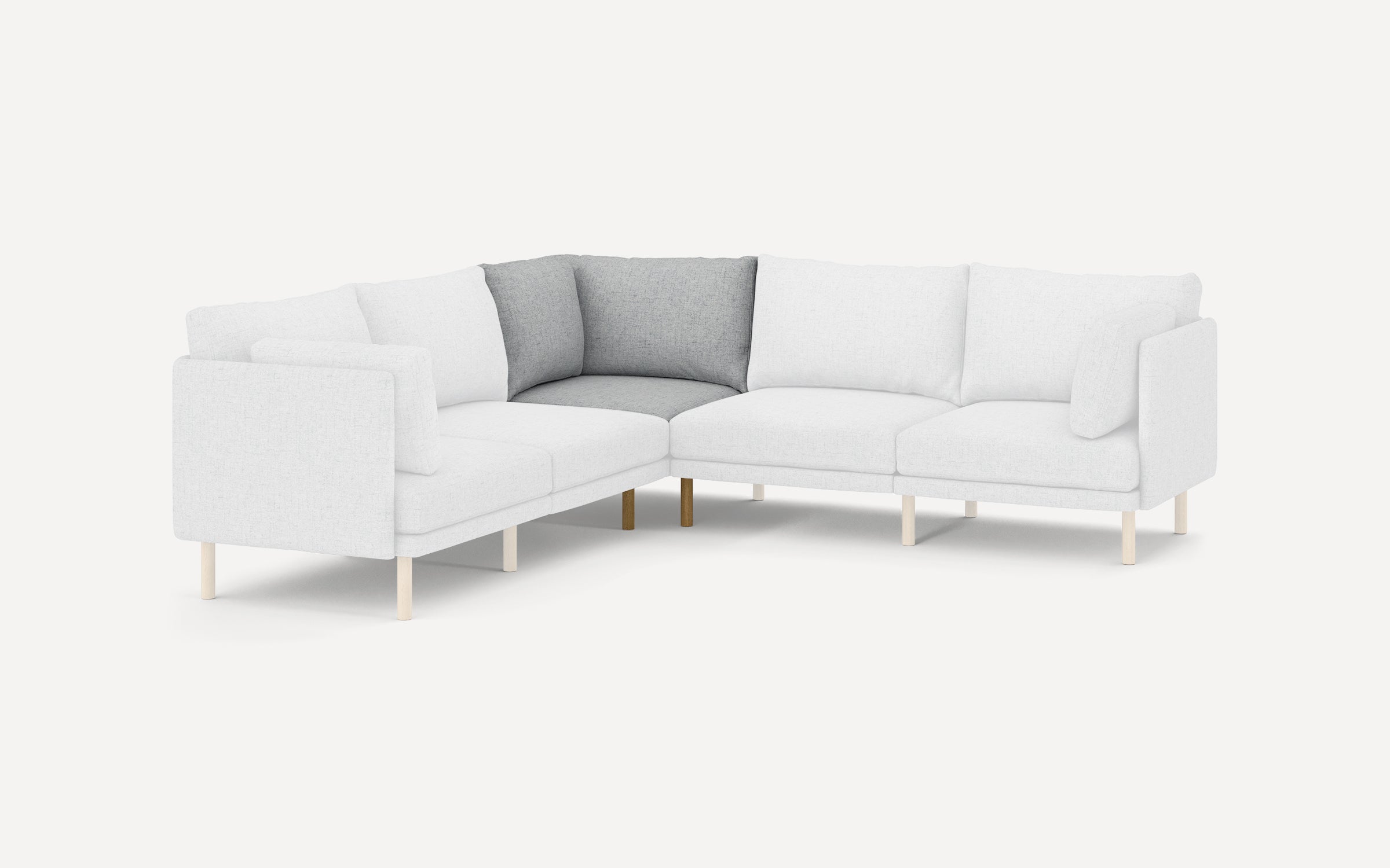 Modern L-shaped sectional sofa with light gray fabric upholstery and wooden legs, featuring contrasting darker cushions in the corner.