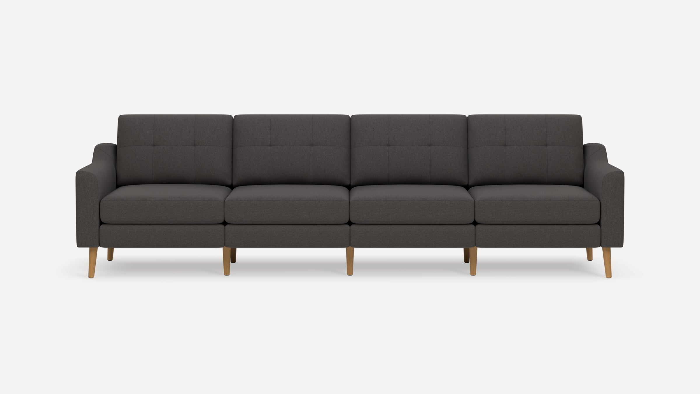 Four-seat modern dark gray fabric sofa with wooden legs and tufted back cushions, featuring slim armrests.