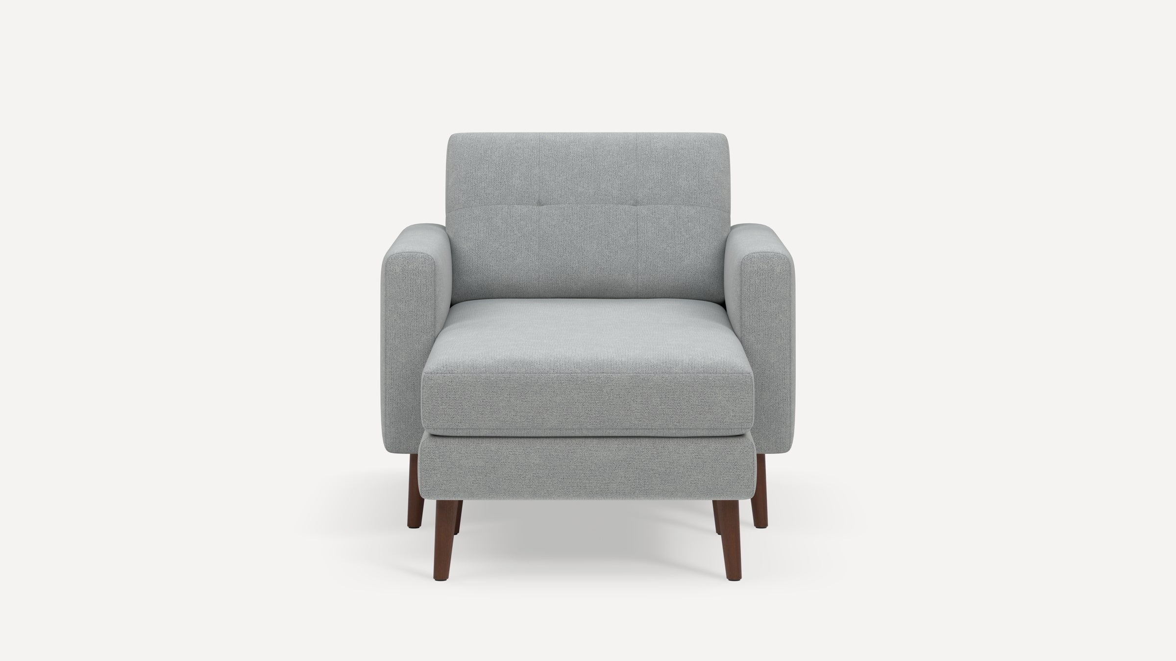 Modern light gray fabric armchair with square arms, tufted back, and dark wooden legs on a white background.