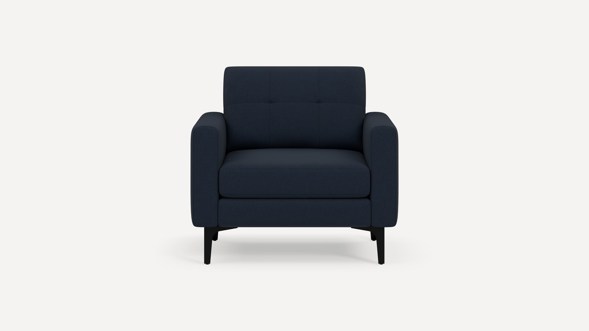 Modern navy blue upholstered armchair with clean lines, tufted backrest, and black angled legs on white background.