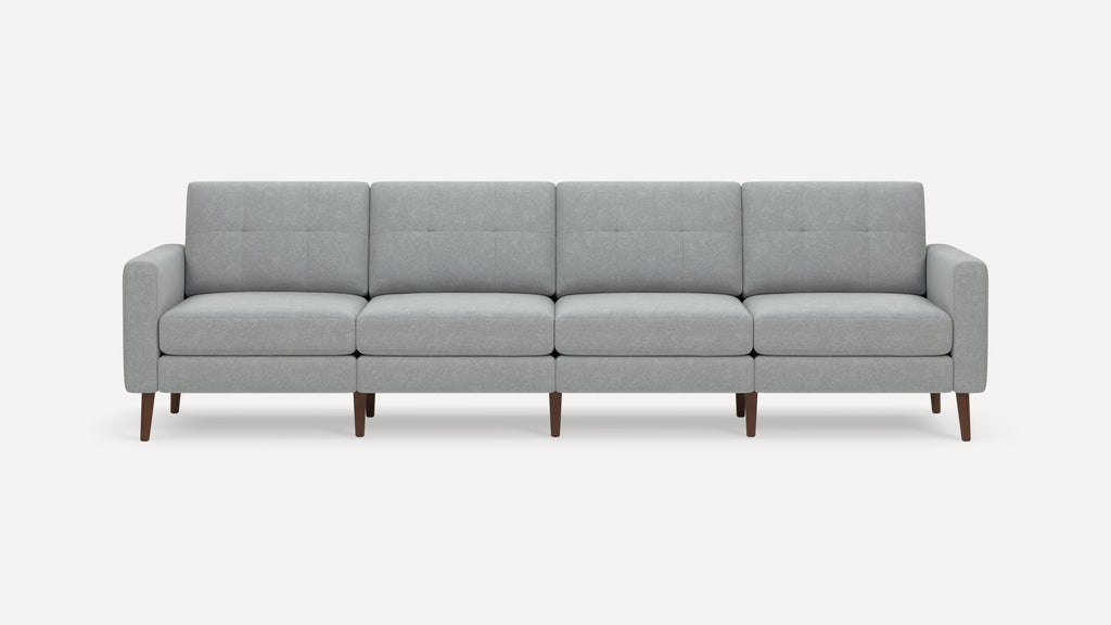 Modern light gray fabric sofa with four cushioned seats, tufted backrests, armrests, and wooden legs.