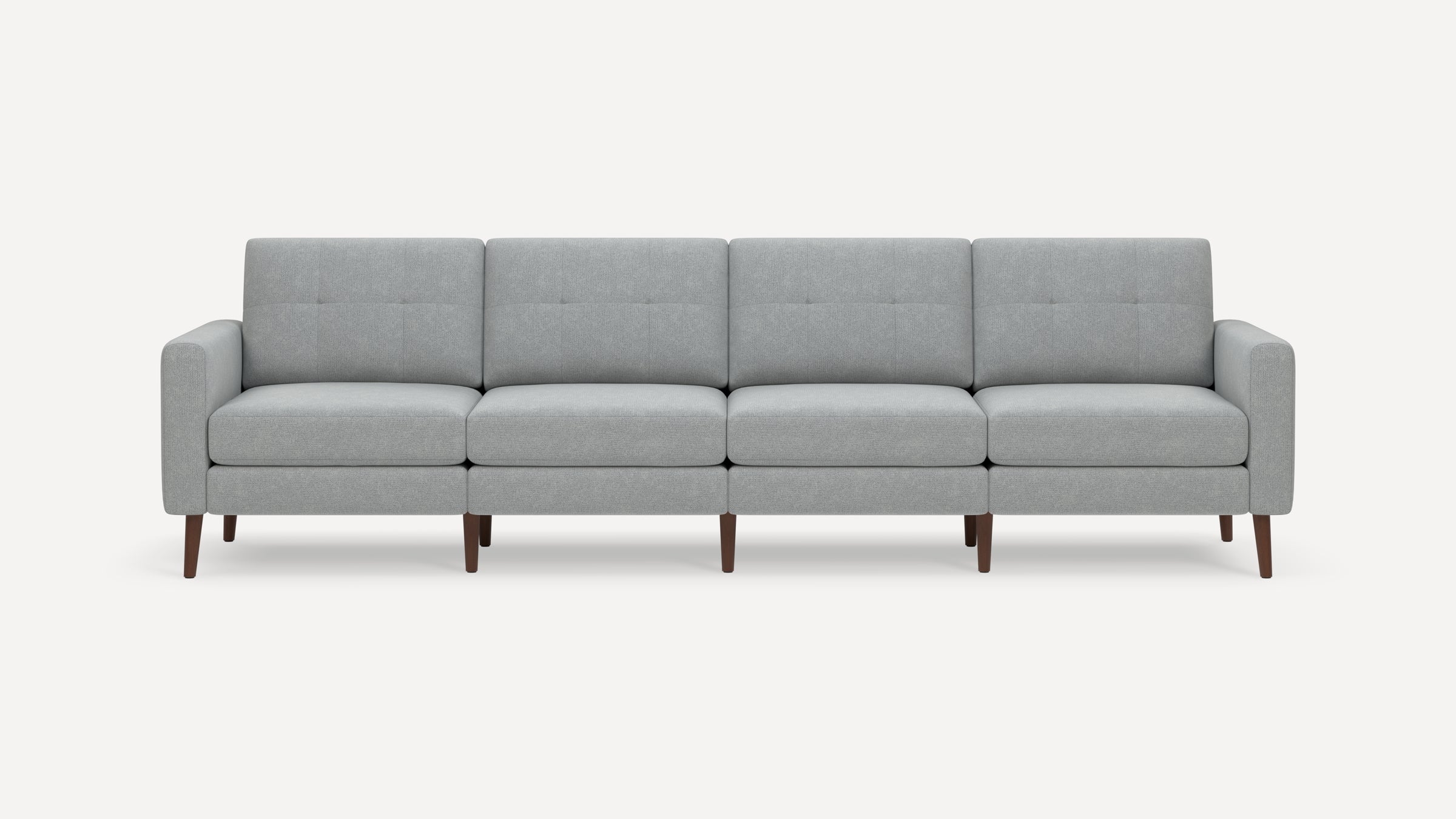 Modern light gray fabric sofa with four cushioned seats, tufted backrests, armrests, and wooden legs.