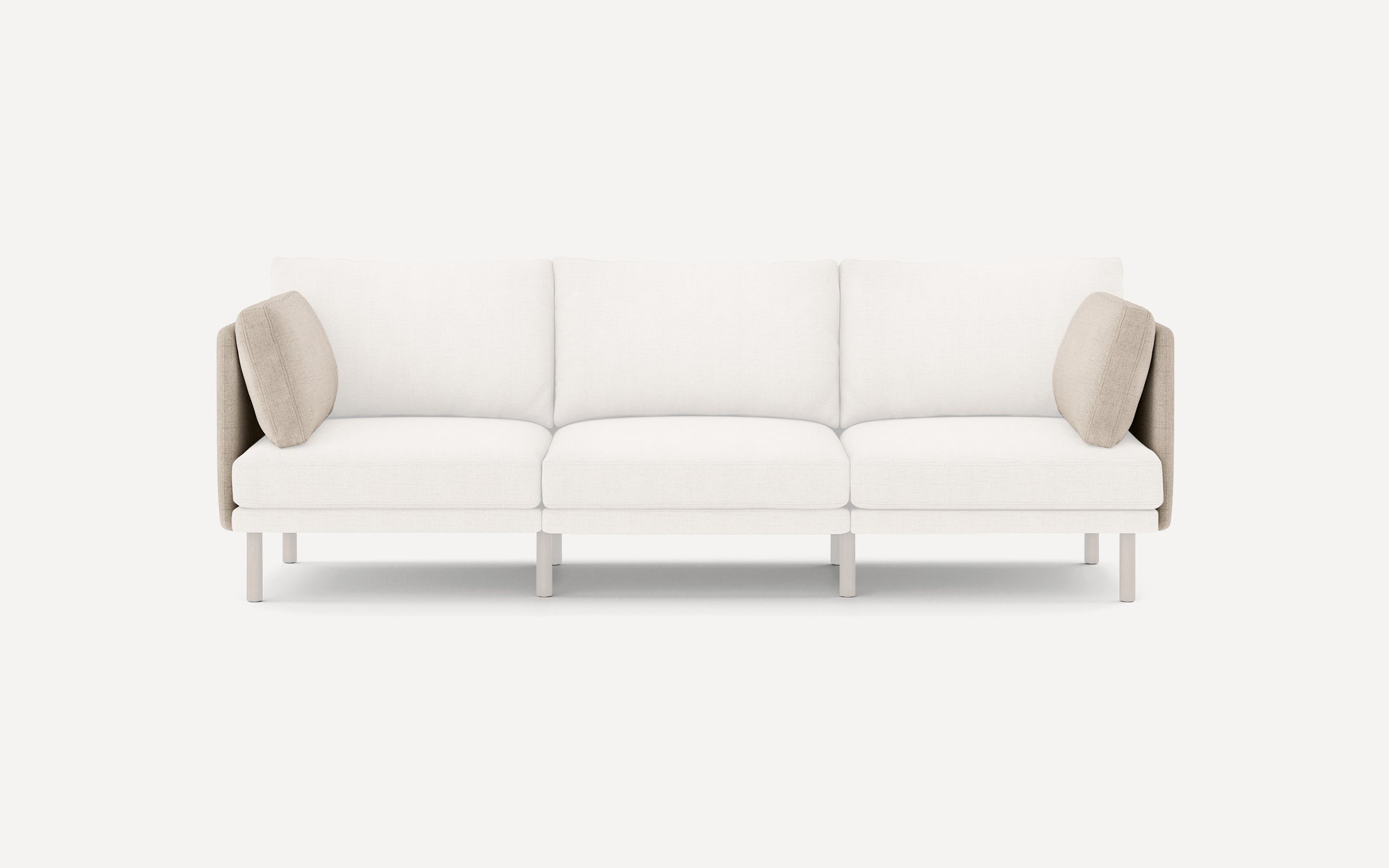 Modern three-seater sofa with white cushions and beige armrests, set against a plain background.