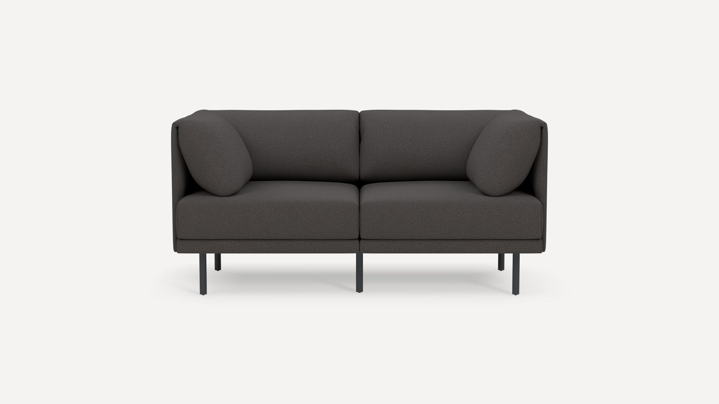 Modern dark gray two-seater sofa with rounded cushions and slim black metal legs, shown on a plain white background.