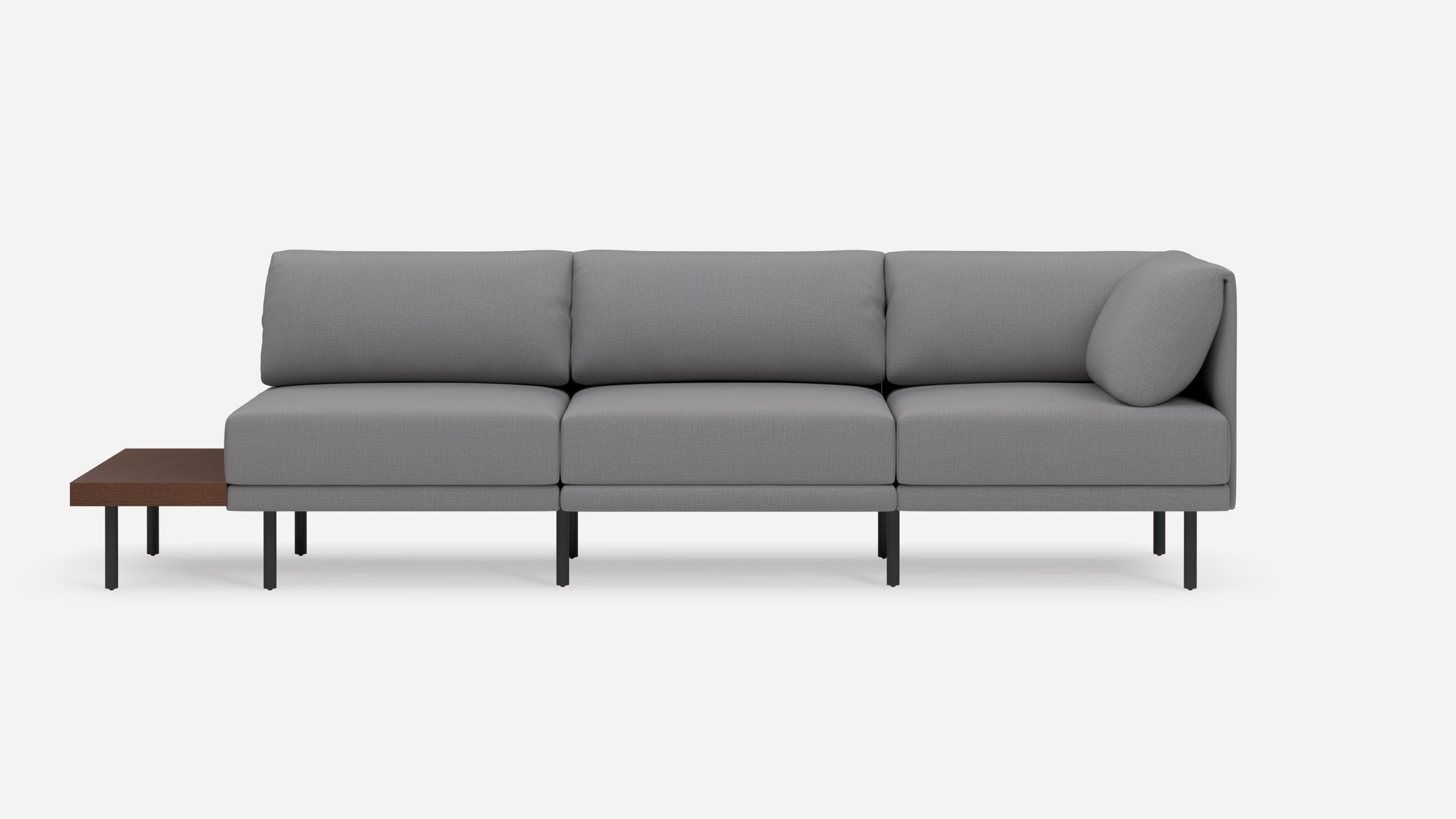Modern gray sectional sofa with metal legs and an integrated wooden side table on the left side.