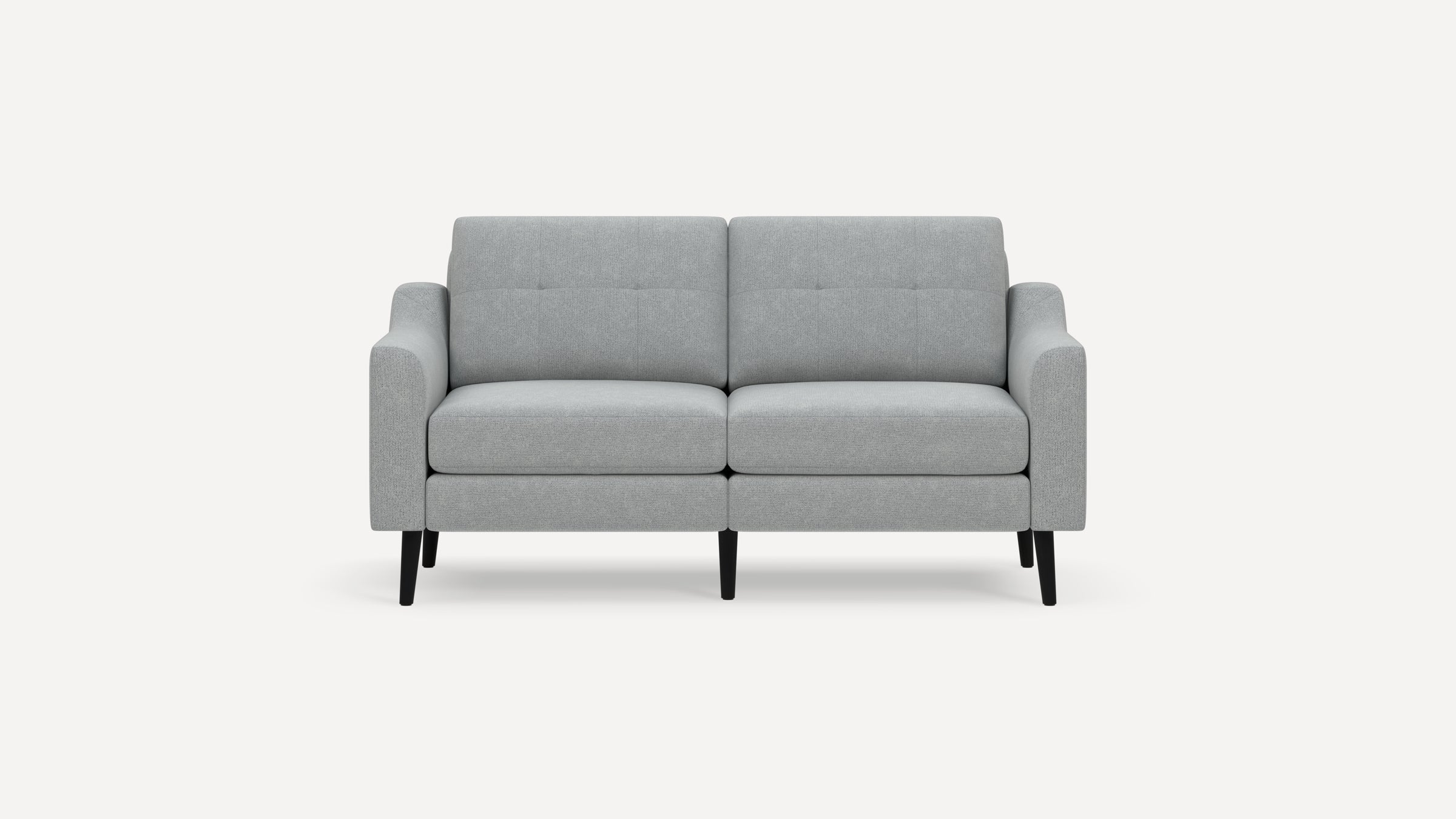 Light gray two-seater sofa with a modern design, straight arms, tufted back cushions, and black tapered legs.