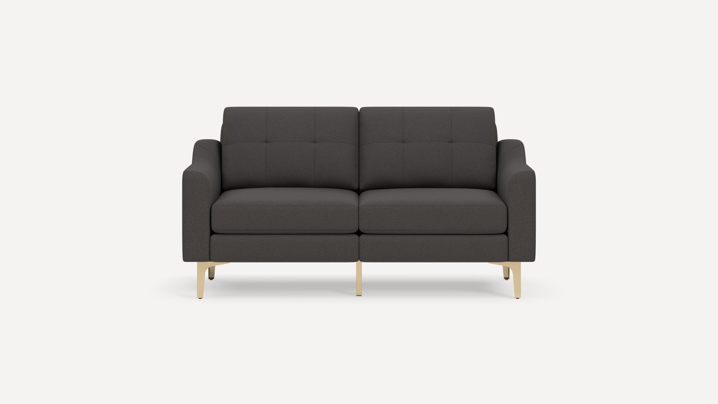 Dark gray two-seater sofa with tufted backrest, cushioned seats, straight arms, and light wood legs on white background.