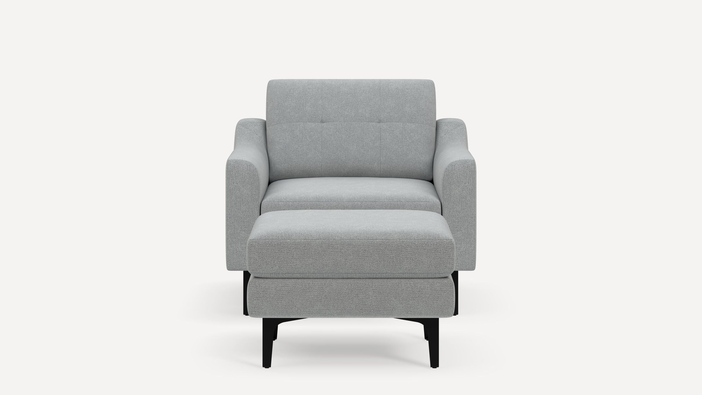 Front view of a modern light gray upholstered armchair with angled black legs and a matching ottoman.