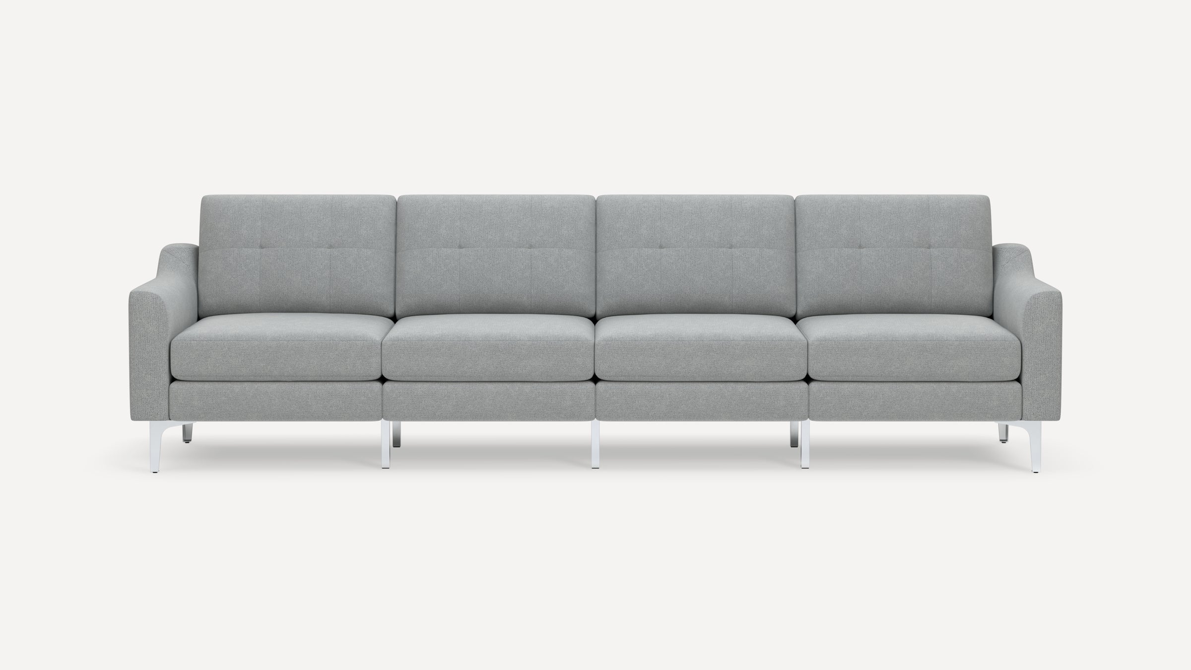 Modern four-seat gray fabric sofa with tufted cushions and metal legs, featuring padded armrests and a minimalist design.