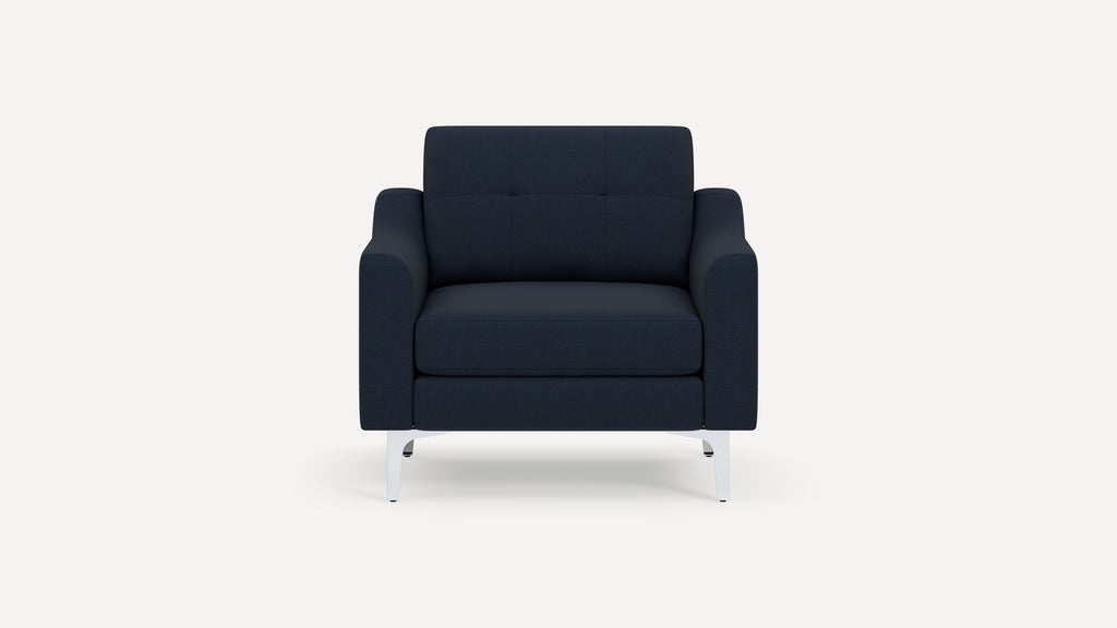 Front view of a modern navy blue fabric armchair with straight armrests and chrome metal legs.