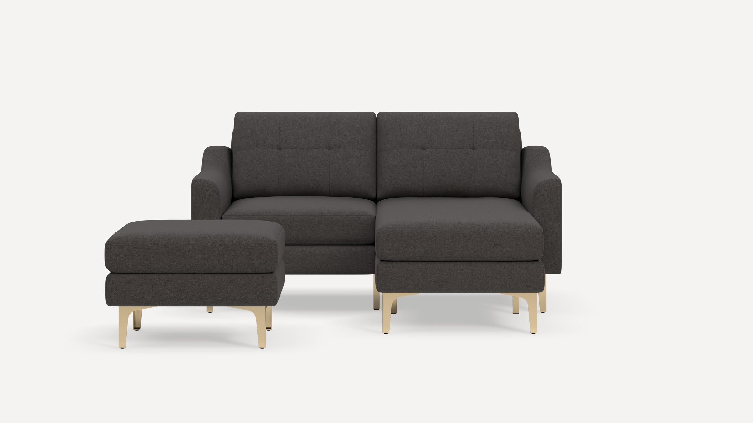 Dark gray modern sectional sofa with tufted back cushions and matching ottoman, featuring light wooden legs on a white background.