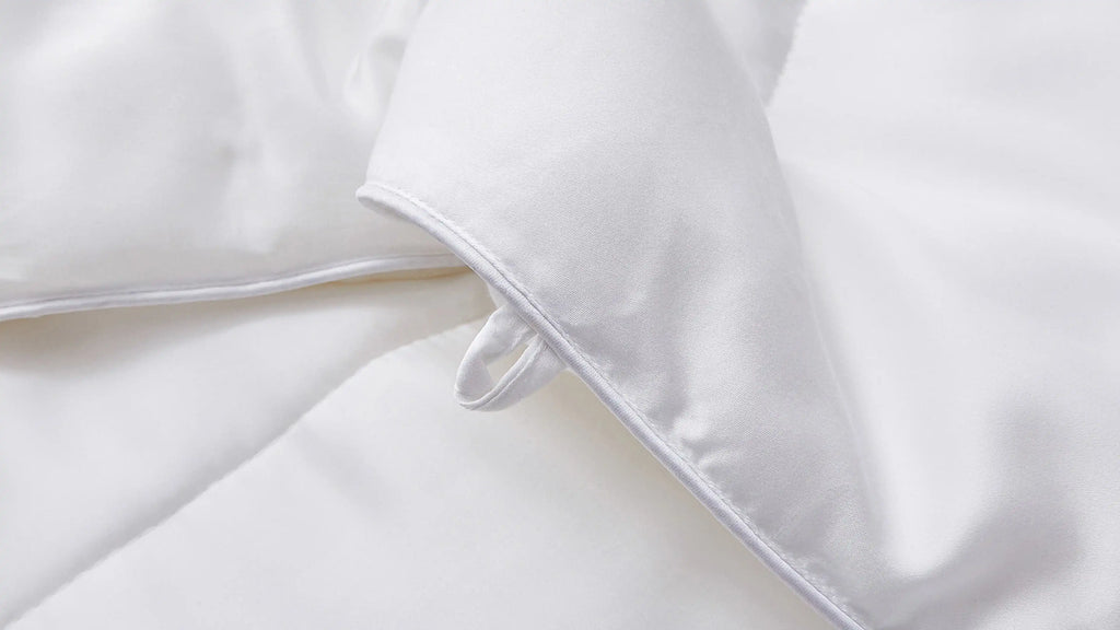 white down comforter with white pillows