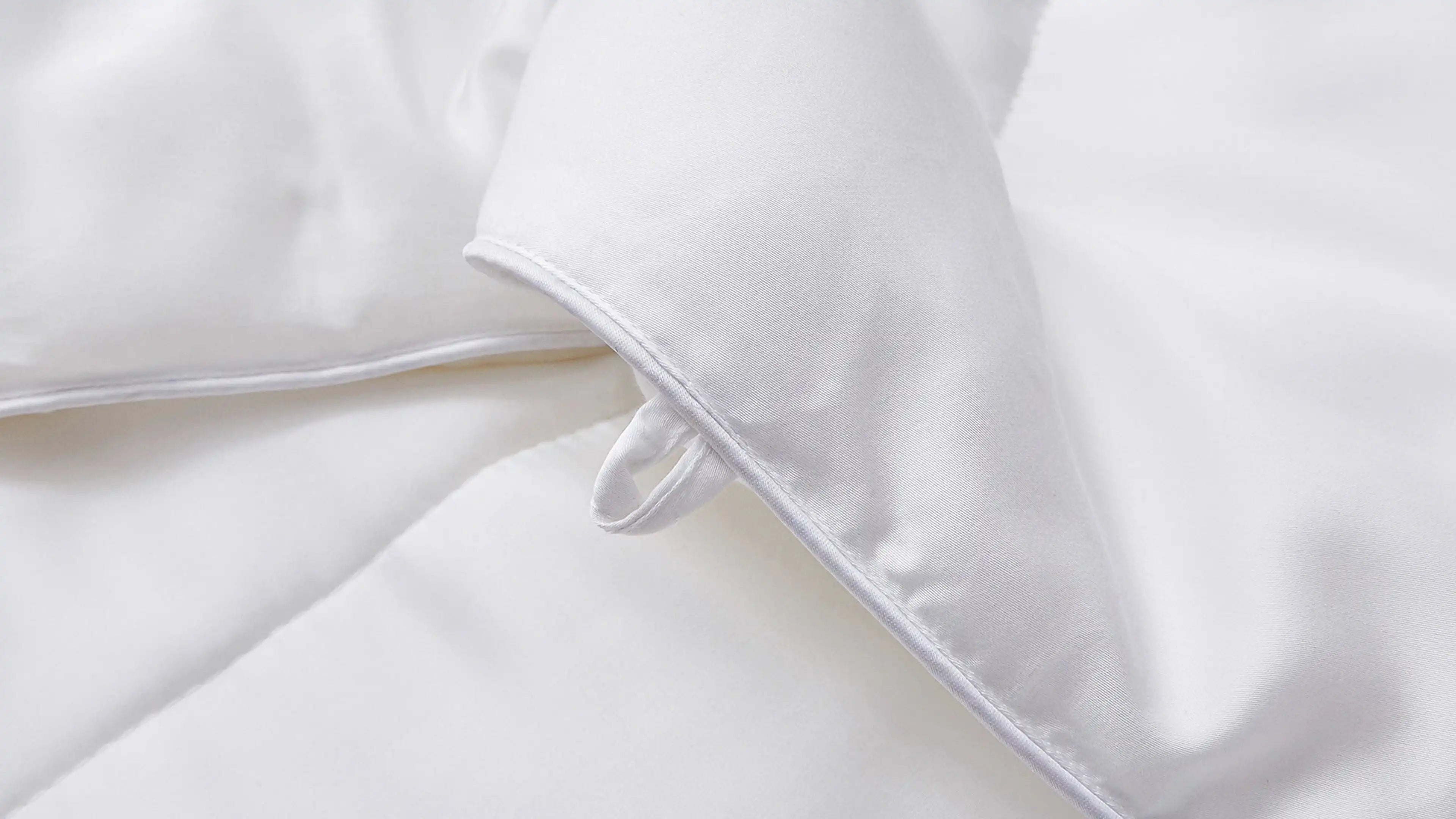 white down comforter with white pillows