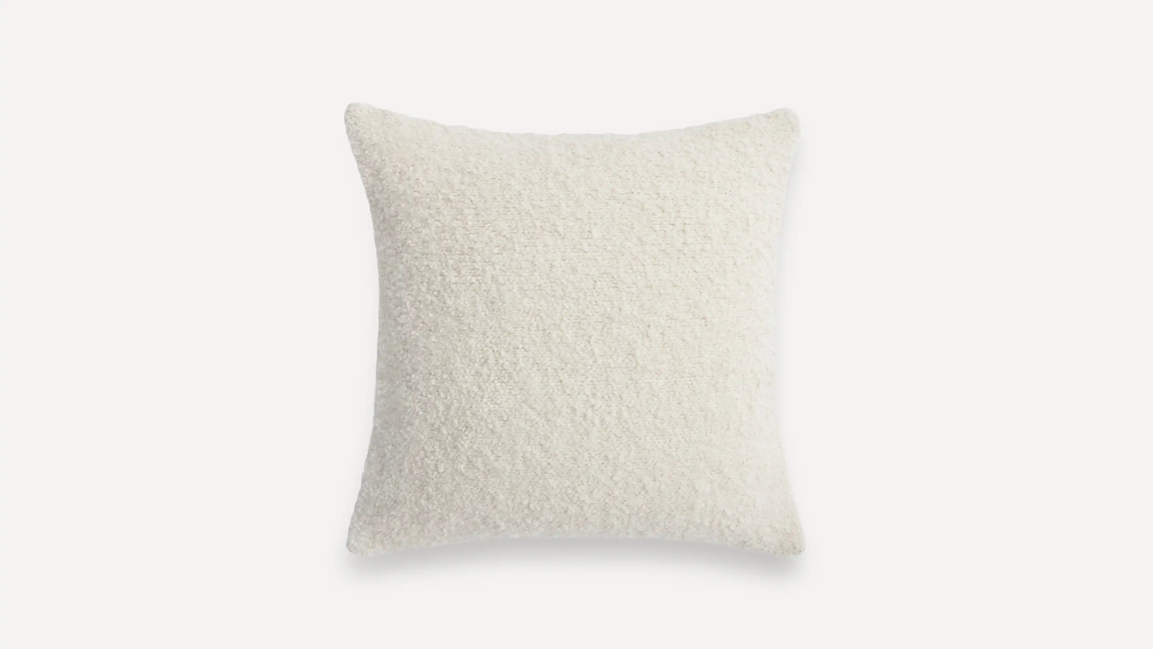 a white pillow with a fluffy texture on it
