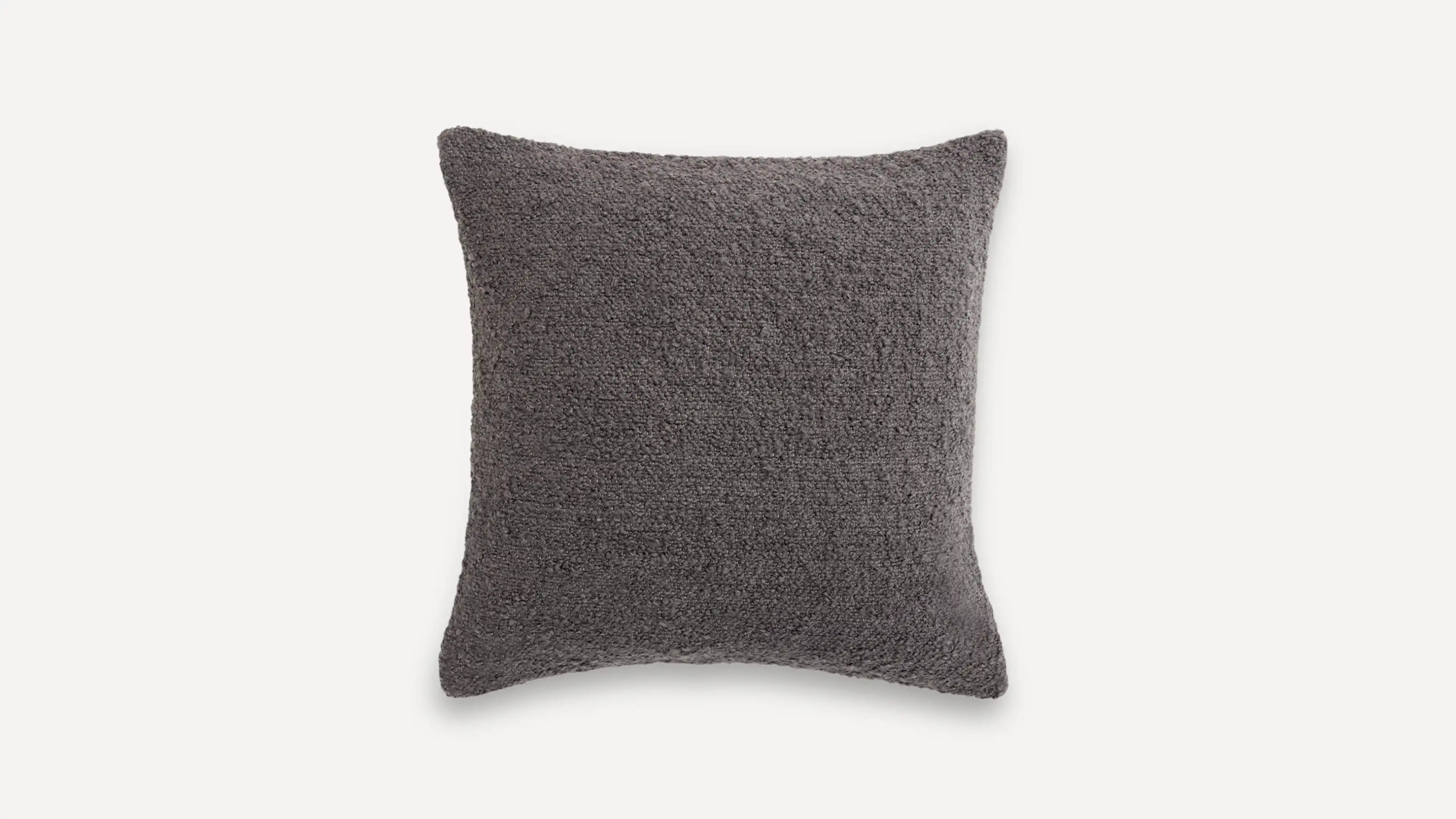a dark gray pillow with a textured design
