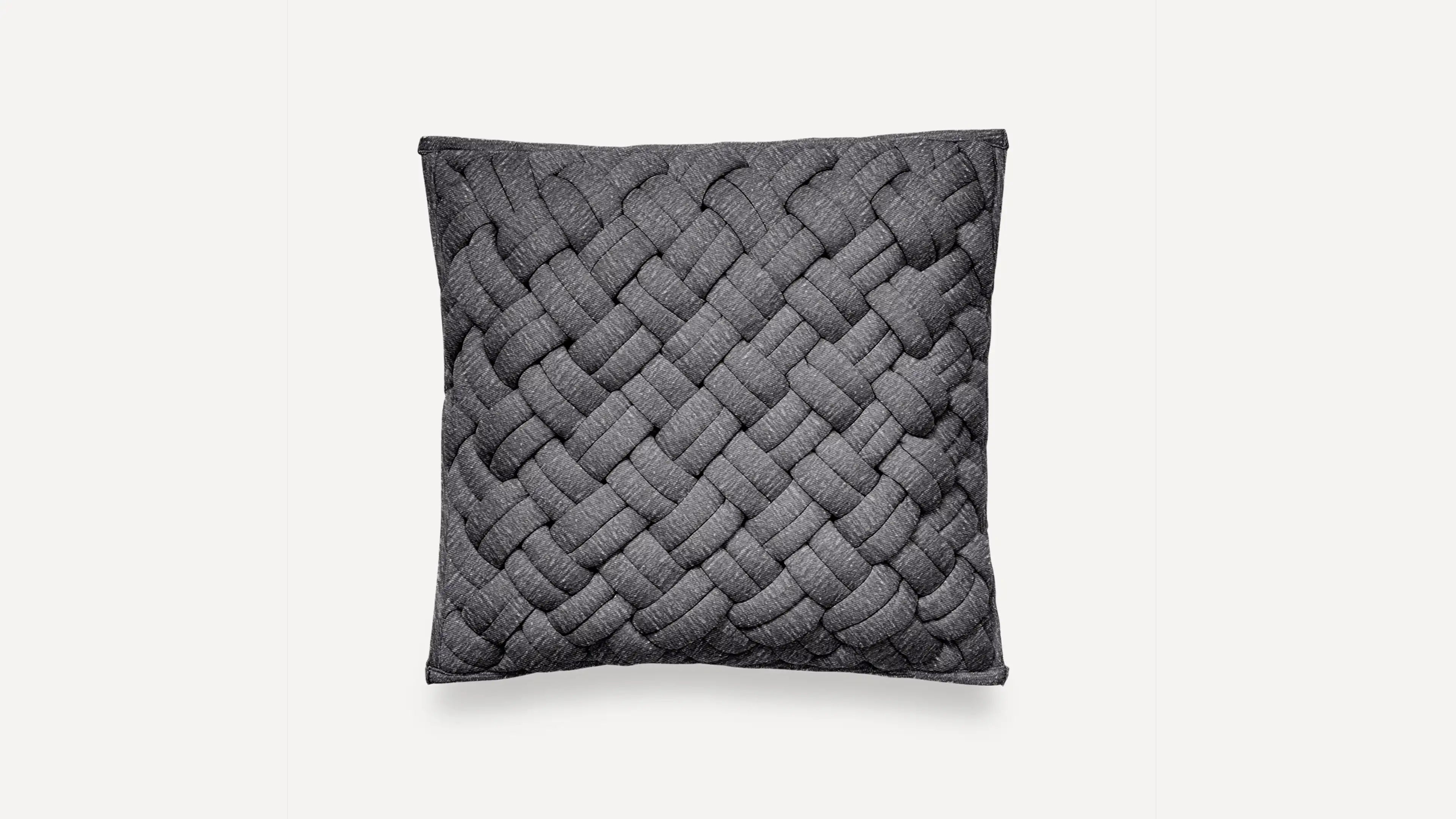 a dark gray cushion with braiding pattern on the front