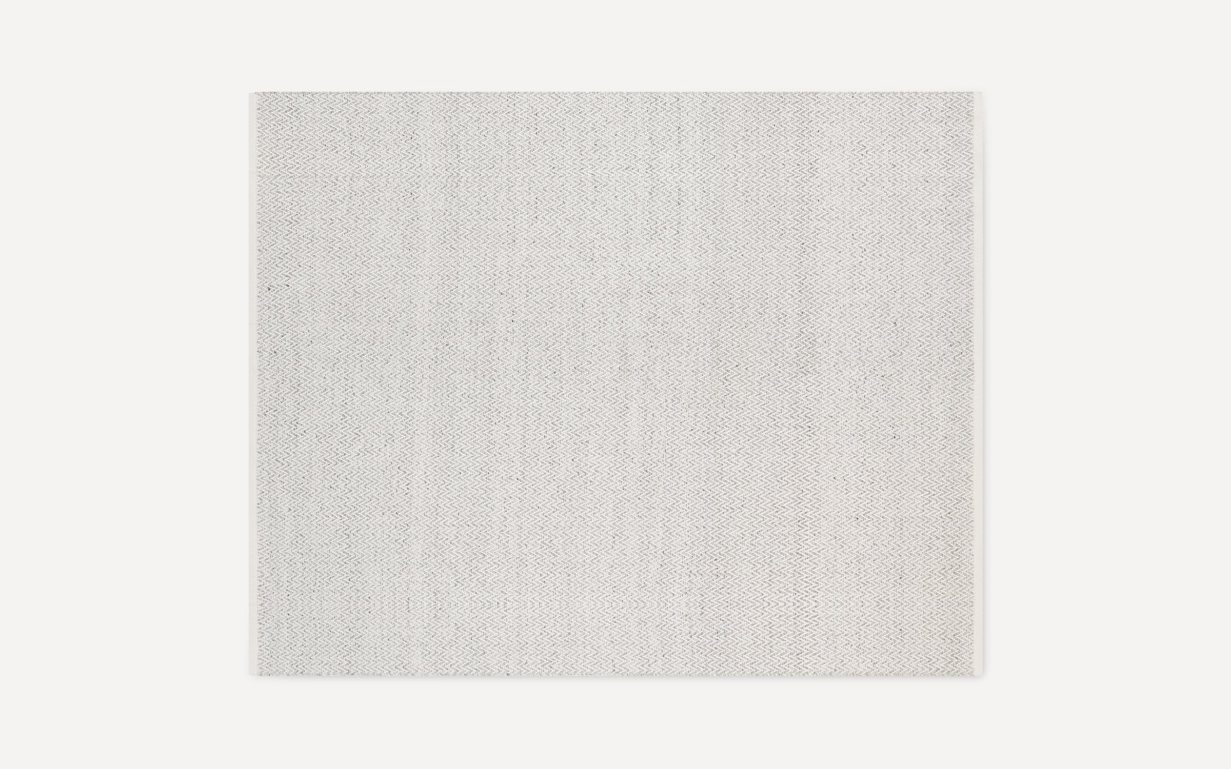 Rectangular light gray rug with a subtle herringbone pattern, flat woven texture, and clean, finished edges.