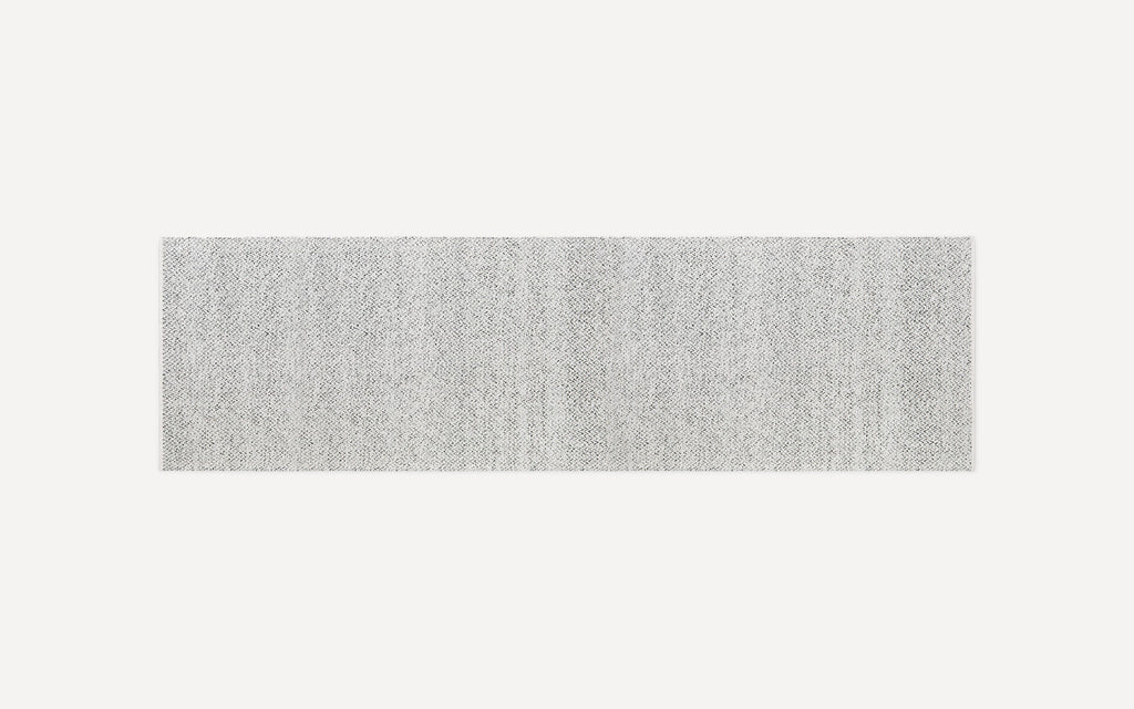 Light gray rectangular textured rug with a subtle woven pattern, shown on a white background.