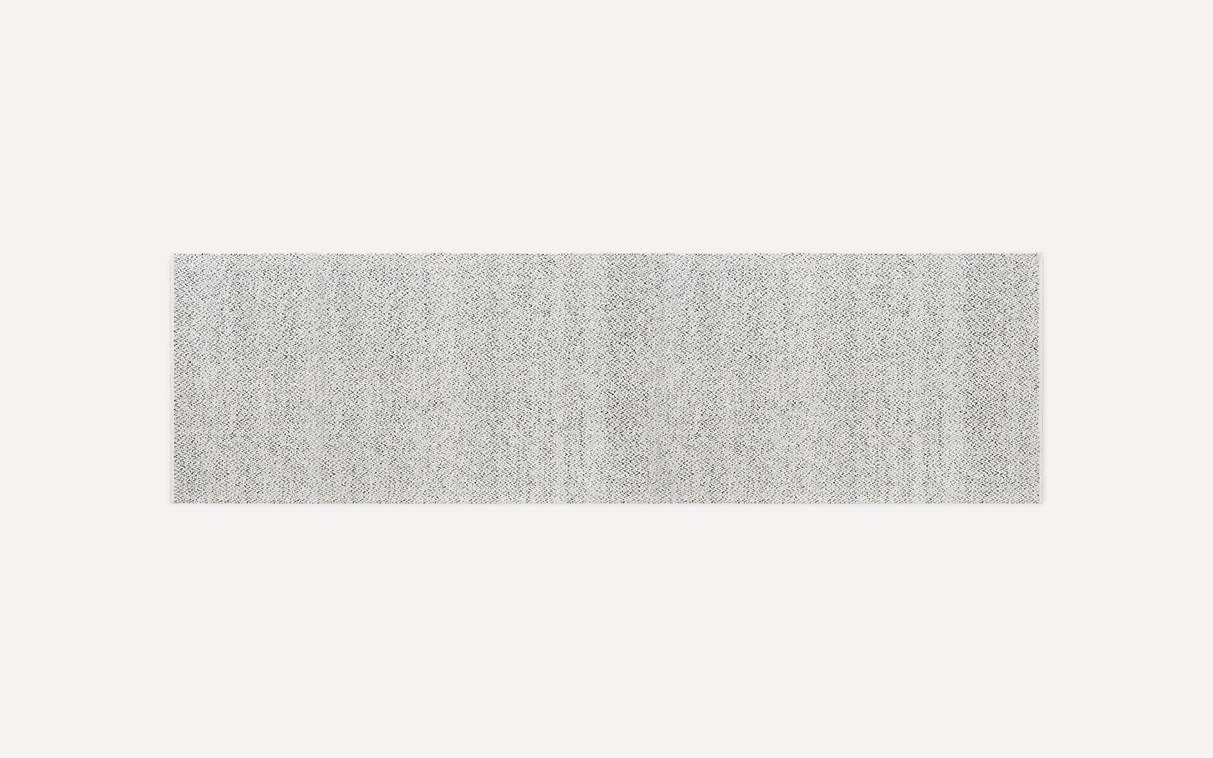 Light gray rectangular textured rug with a subtle woven pattern, shown on a white background.