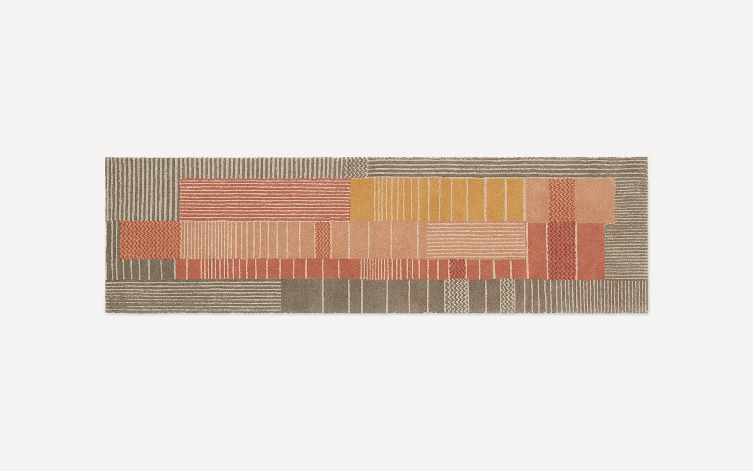 Rectangular runner rug with a patchwork design in earthy tones of beige, rust, mustard, and brown featuring various linear and zigzag patterns.