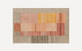 Rectangular area rug with abstract geometric blocks in beige, mustard yellow, coral, and terracotta colors featuring varied striped patterns.