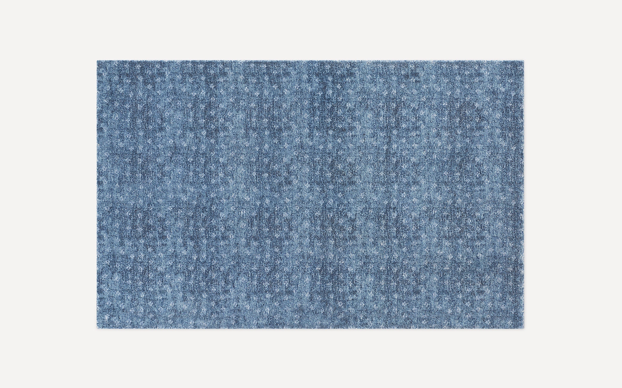 Rectangular blue textured rug with subtle pattern and a soft, plush surface, displayed on a plain white background.