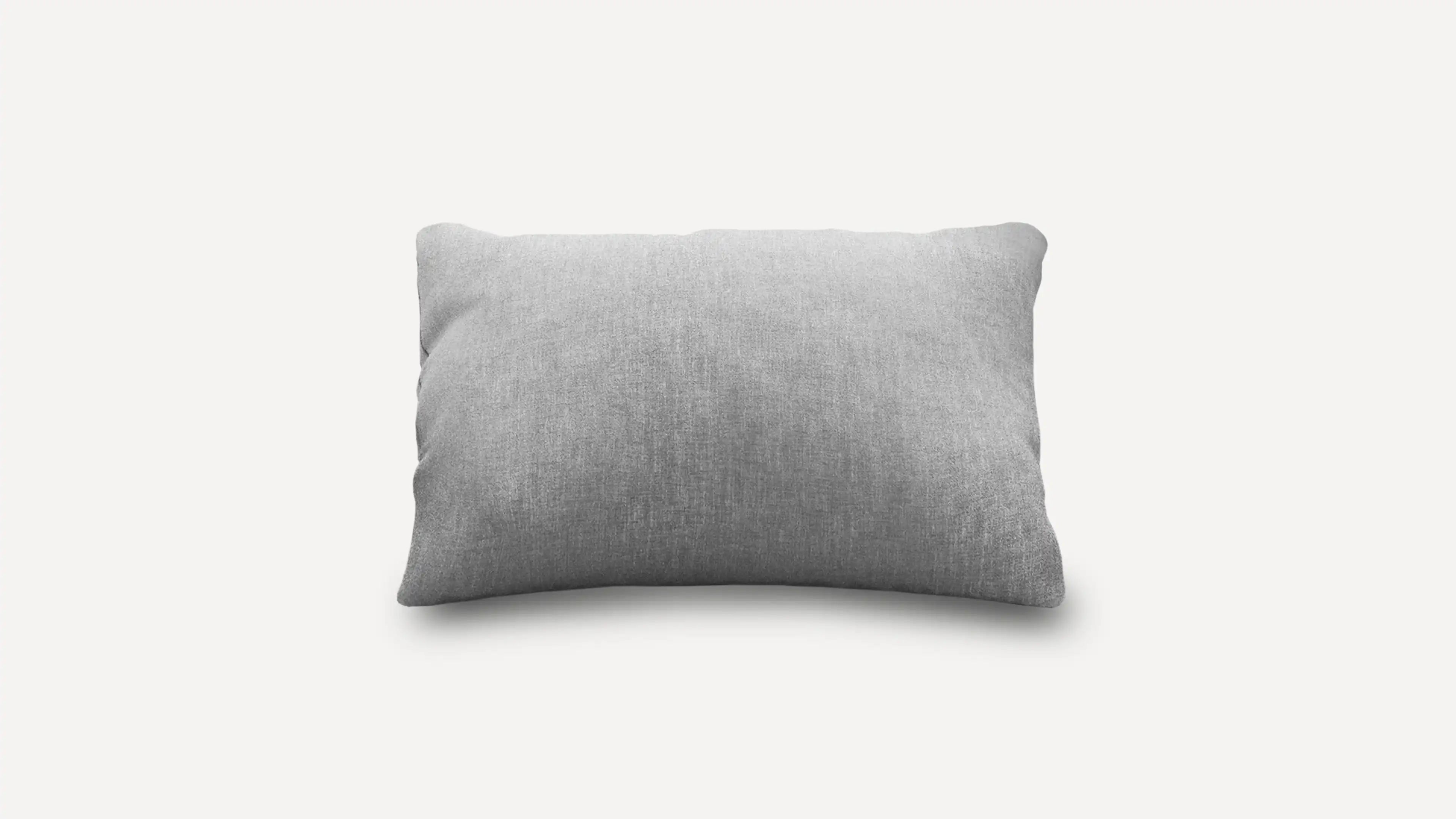 a gray pillow on a white background