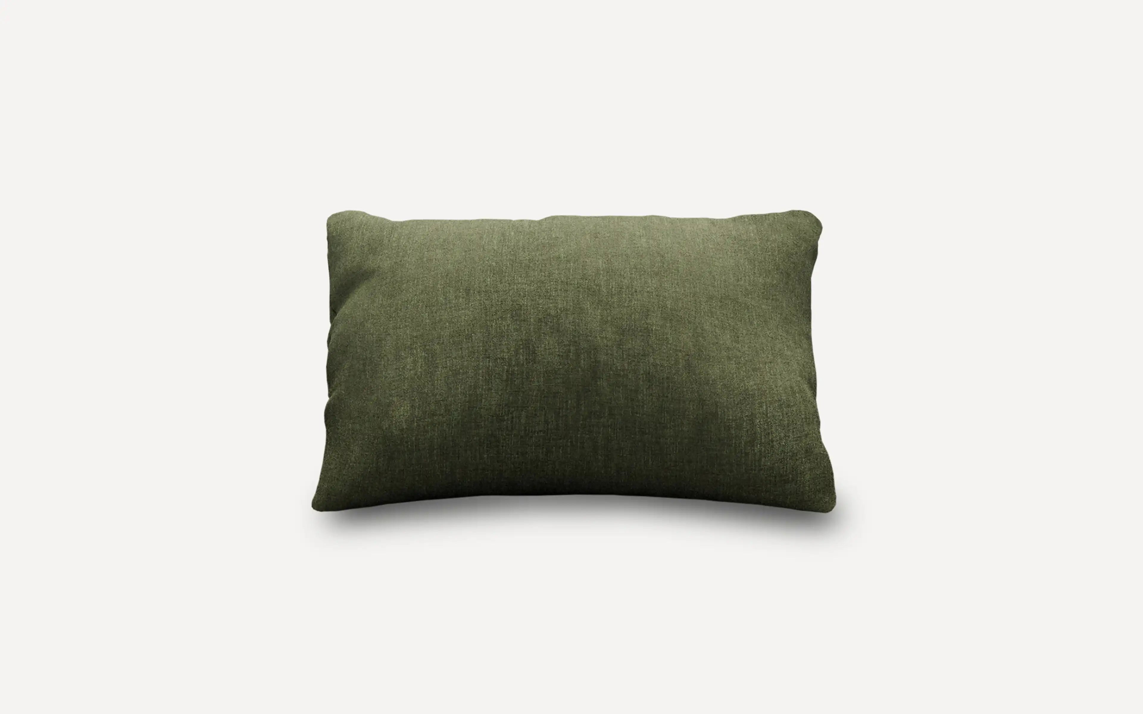 a green cushion on a white background