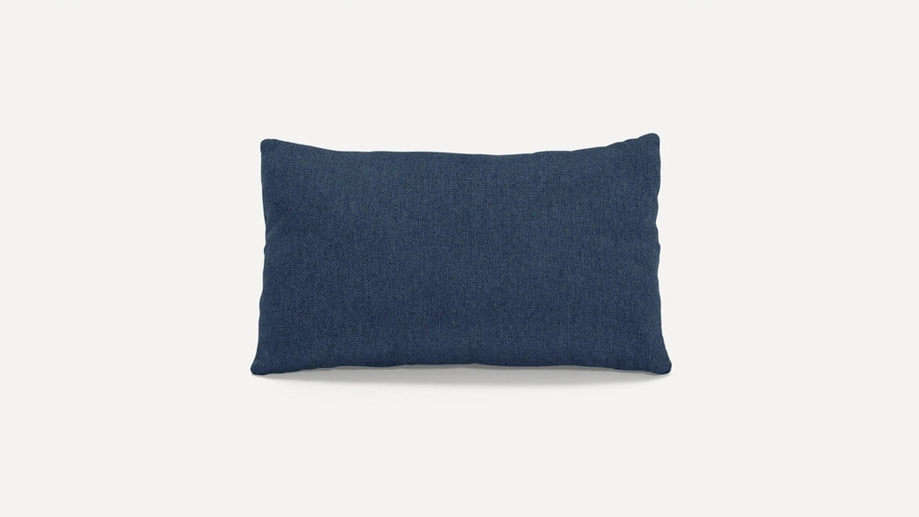 a dark blue cushion with a white background