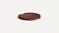 Round wooden serving tray with raised edges and open cut-out sections, displayed on a plain white background.