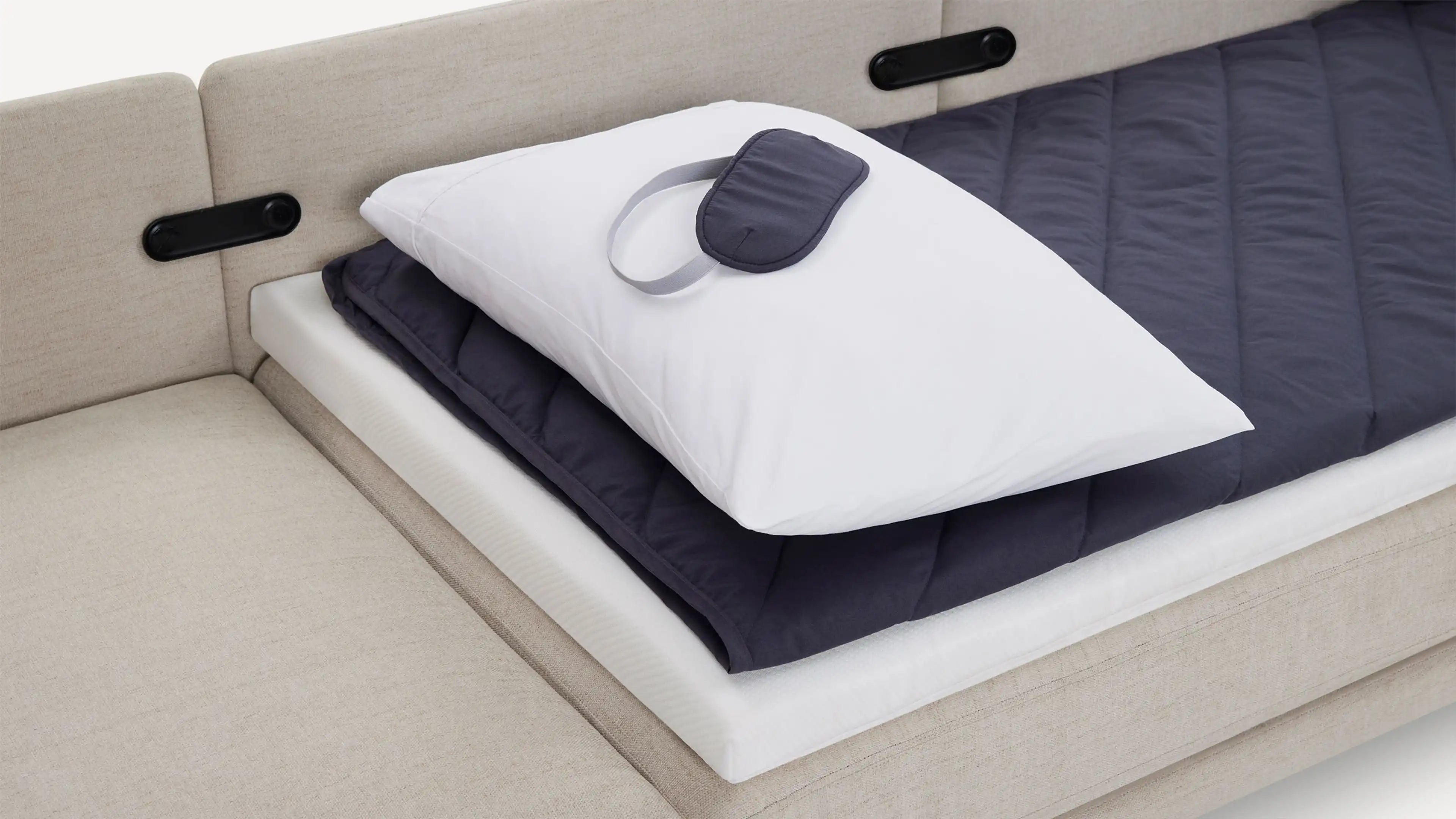 a bed with a pillow and pillow on it