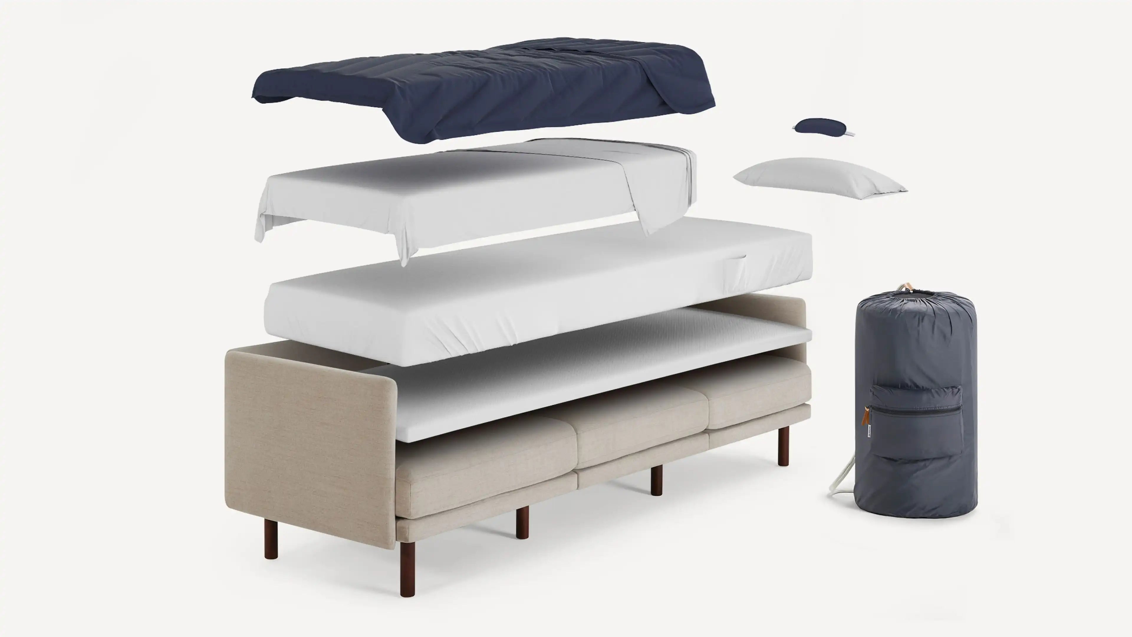 modern sofa with three mattresses, two pillows, and a duff bag