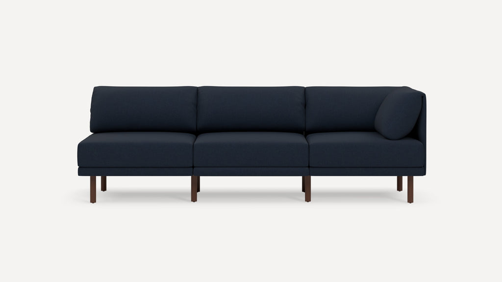 Modern navy blue three-seater sofa with clean lines, rectangular cushions, and wooden legs, displayed against a white background.