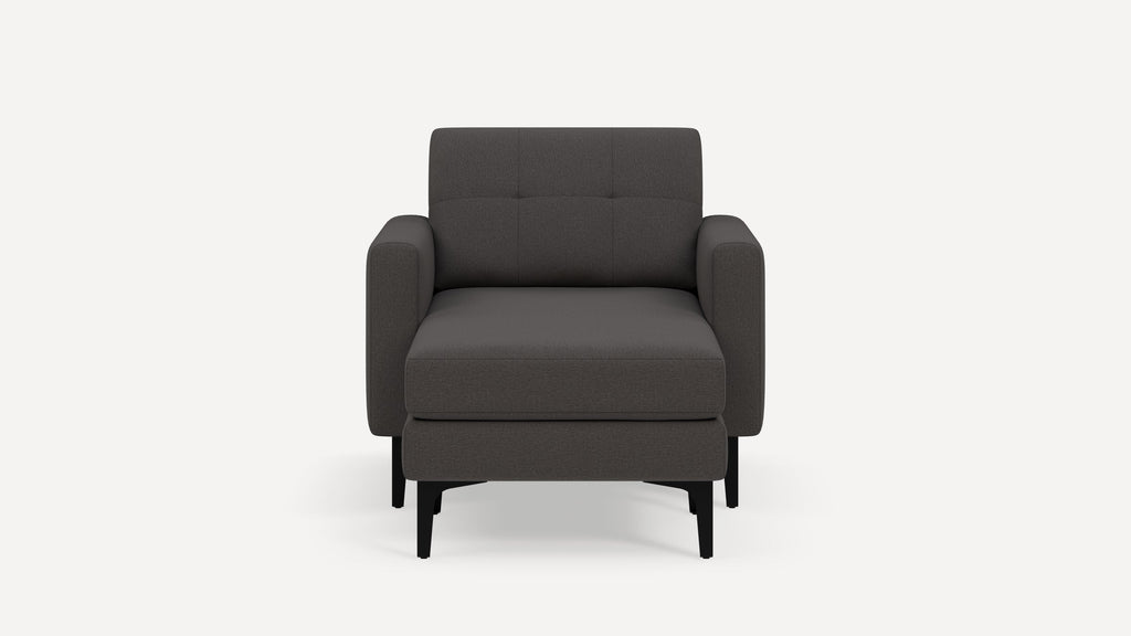 Dark gray modern armchair with cushioned seat and backrest, featuring black slim legs and a clean, minimalist design.