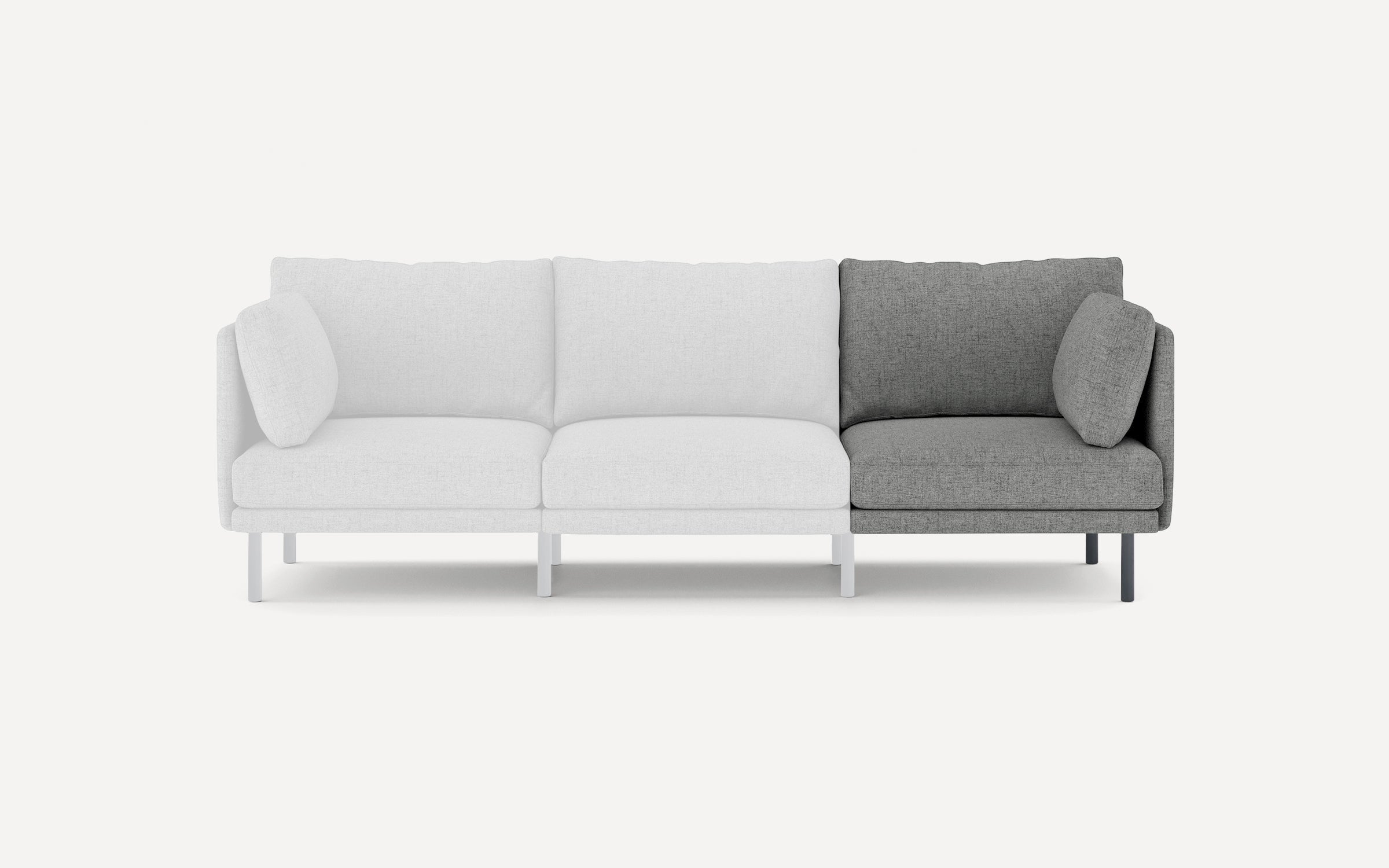Modern three-seater sofa with a minimalist design, featuring light gray cushions on left and middle seats, darker gray cushions on right seat.