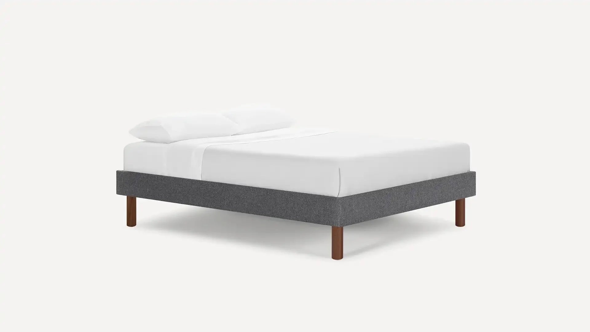 modern upholstered bed with dark gray upholstered bed frame, light gray upholstered bed frame, and white pillows