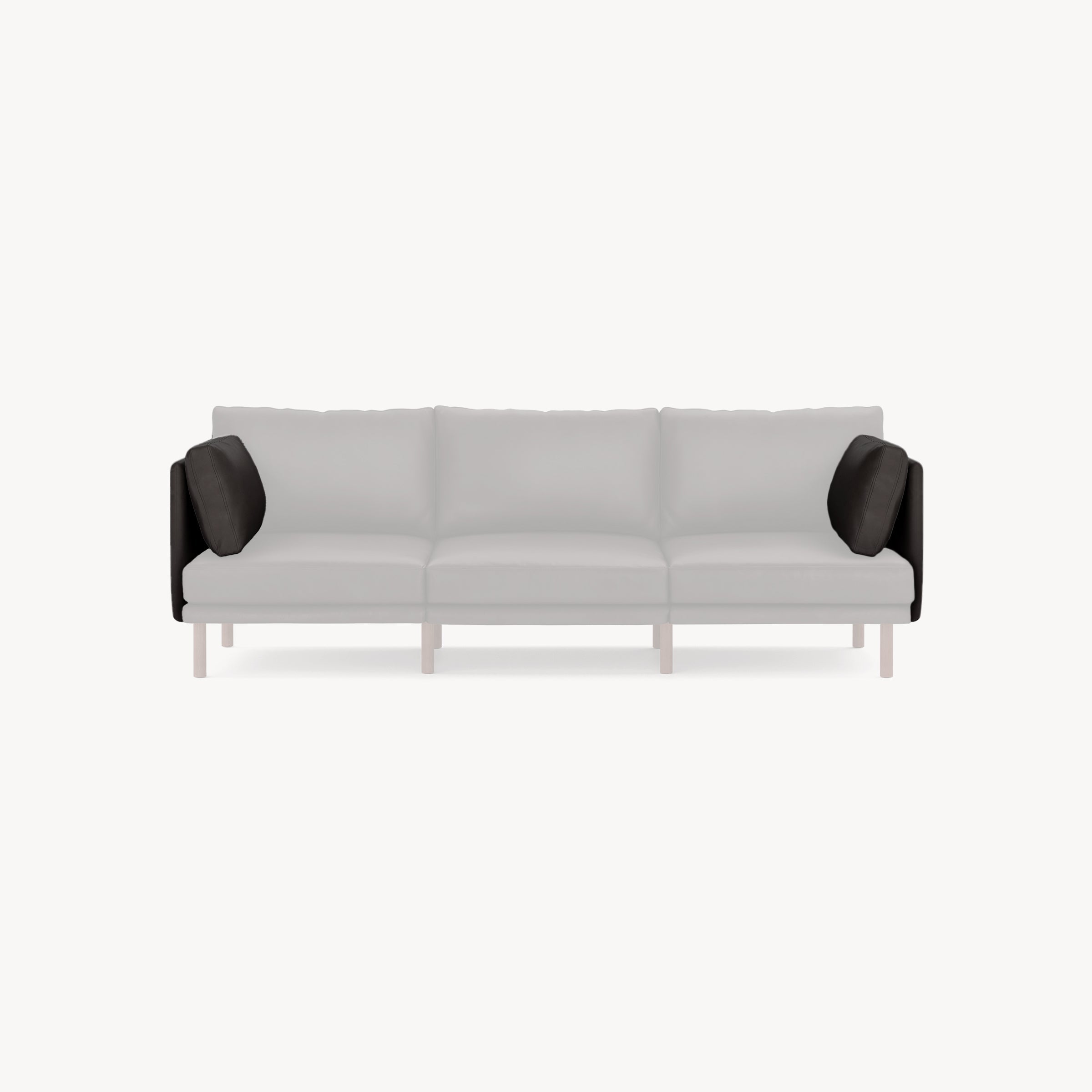 Modern three-seater sofa with light gray cushions, black armrest pillows, and light wooden legs on a plain white background.