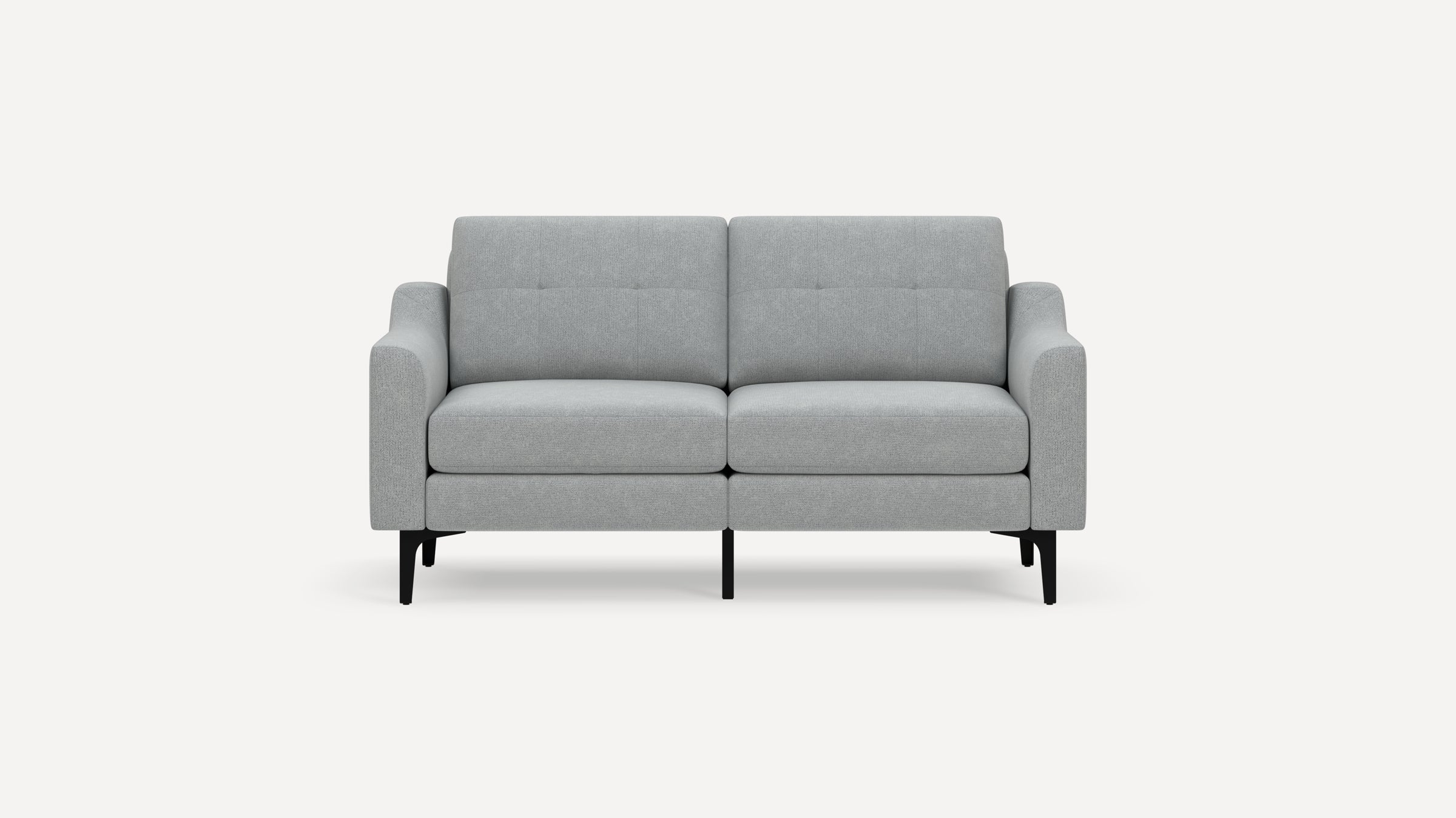 Modern light gray fabric two-seater sofa with low arms, tufted back cushions, and black angled metal legs on a white background.