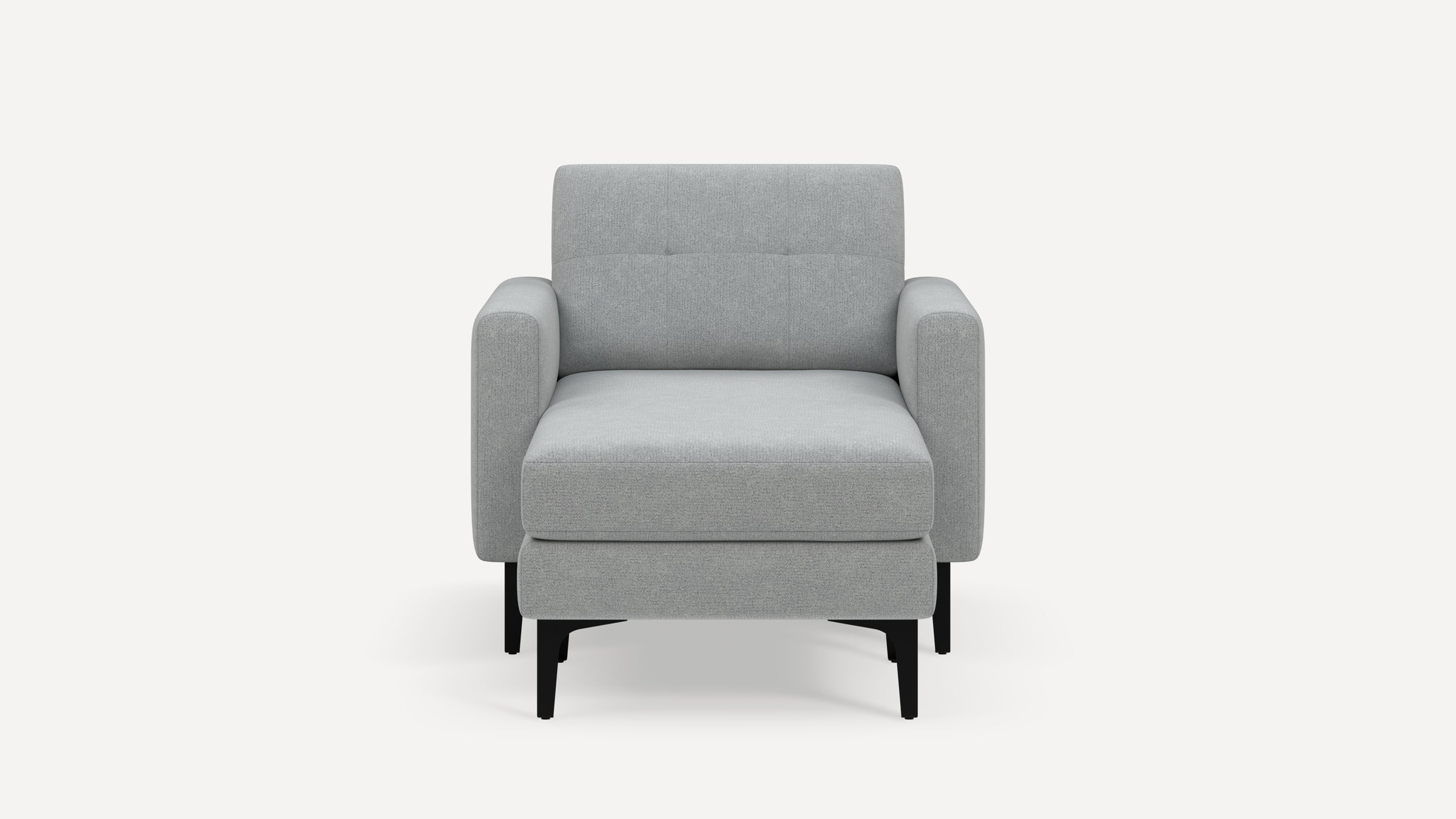 Front view of a modern light gray upholstered armchair with padded armrests and black tapered legs on a white background.