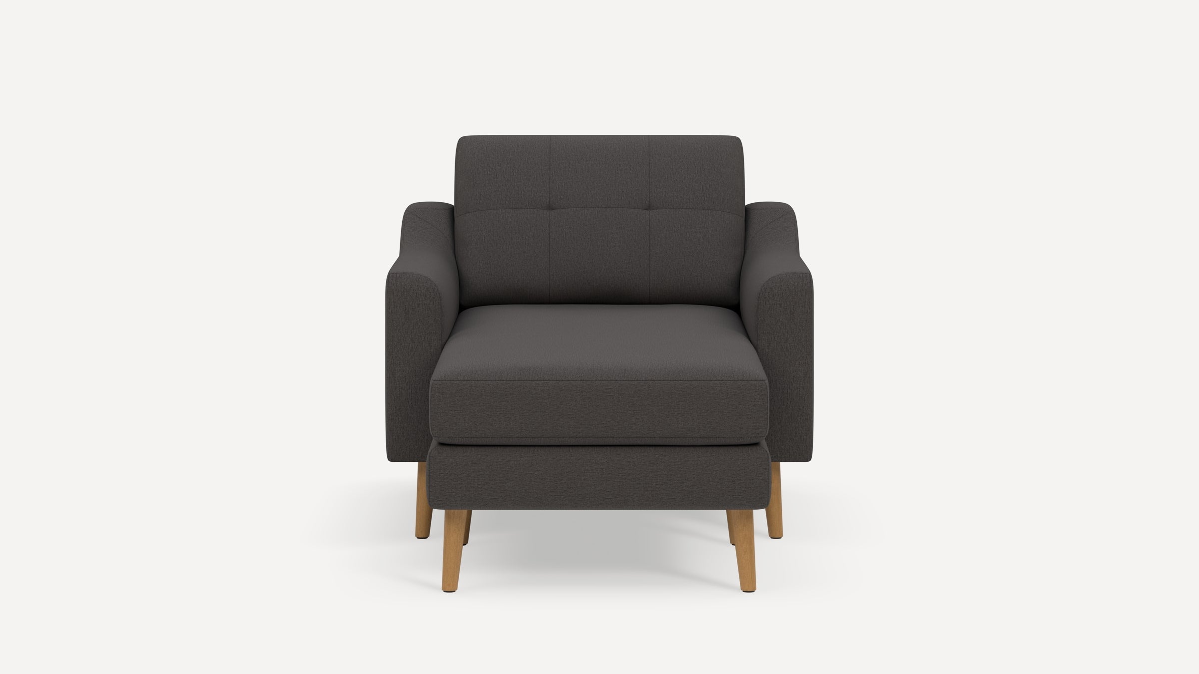 Dark gray upholstered armchair with wooden legs, tufted backrest, and a cushioned seat, shown front-facing.