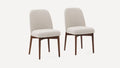 Two beige upholstered dining chairs with rounded backs and walnut-finished wooden legs on a white background.