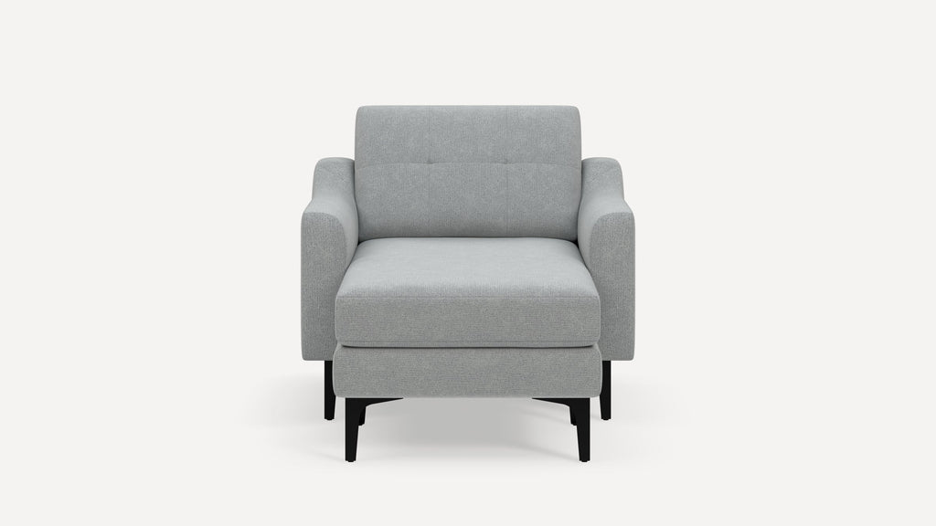 Front view of a modern light gray upholstered armchair with black wooden legs on a plain white background.