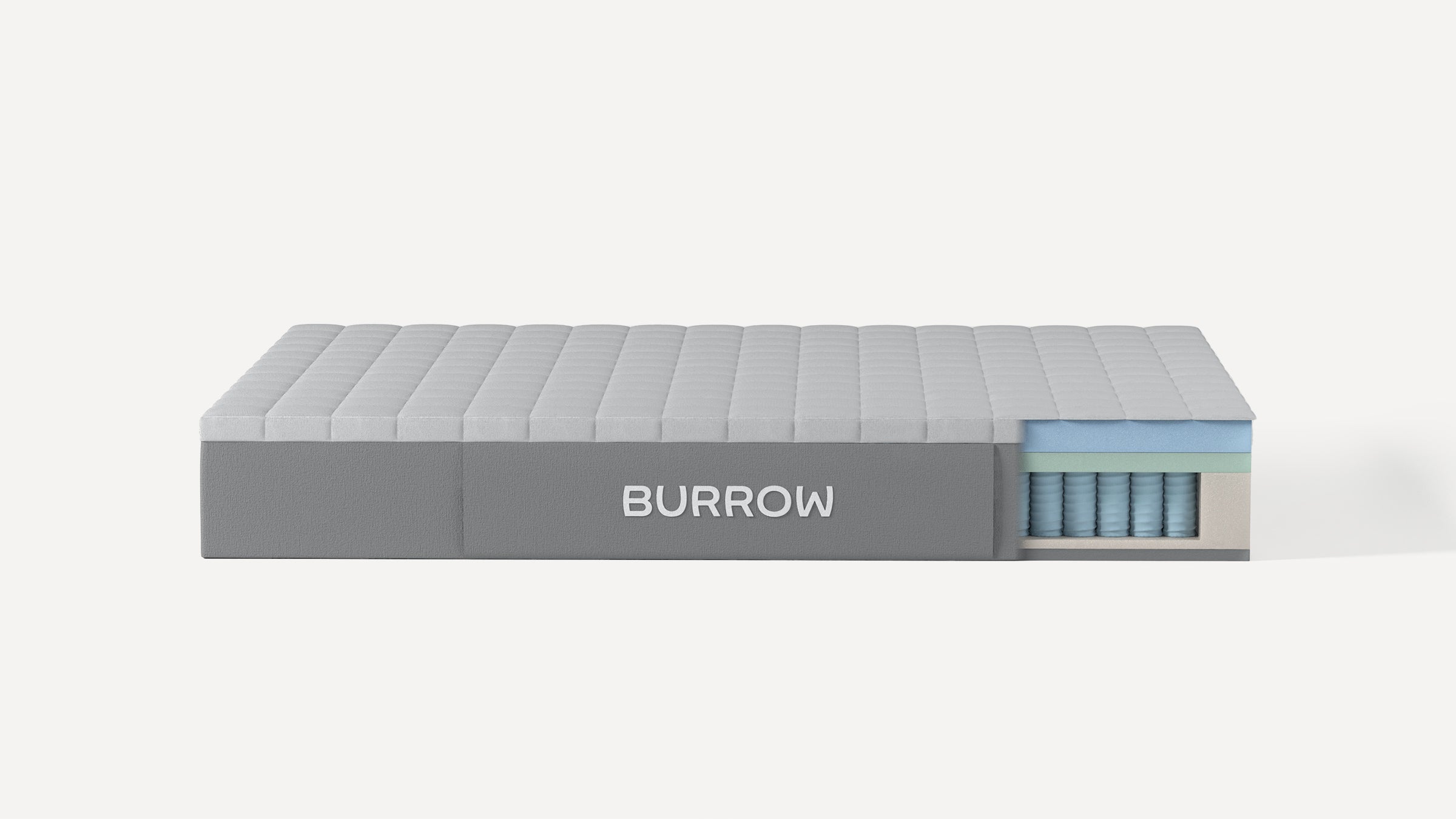 Side view of a Burrow mattress with a cutaway showing layered foam and pocketed coil construction inside.