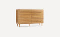 Light wood mid-century modern dresser with six drawers, horizontal handles, and tapered legs on white background.
