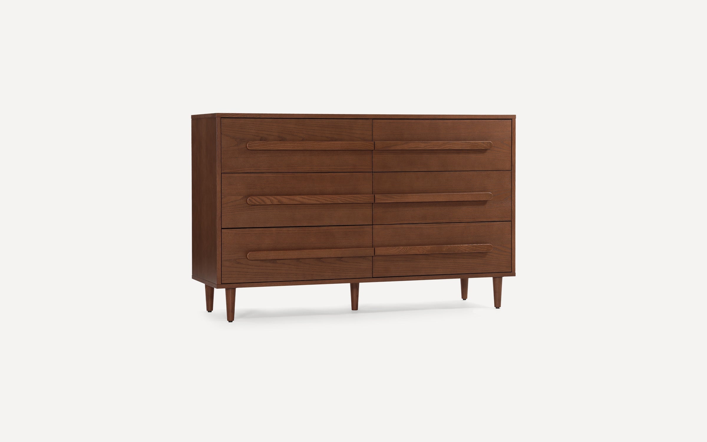 Mid-century modern wooden dresser with six drawers, sleek elongated handles, and tapered legs in a warm brown finish.